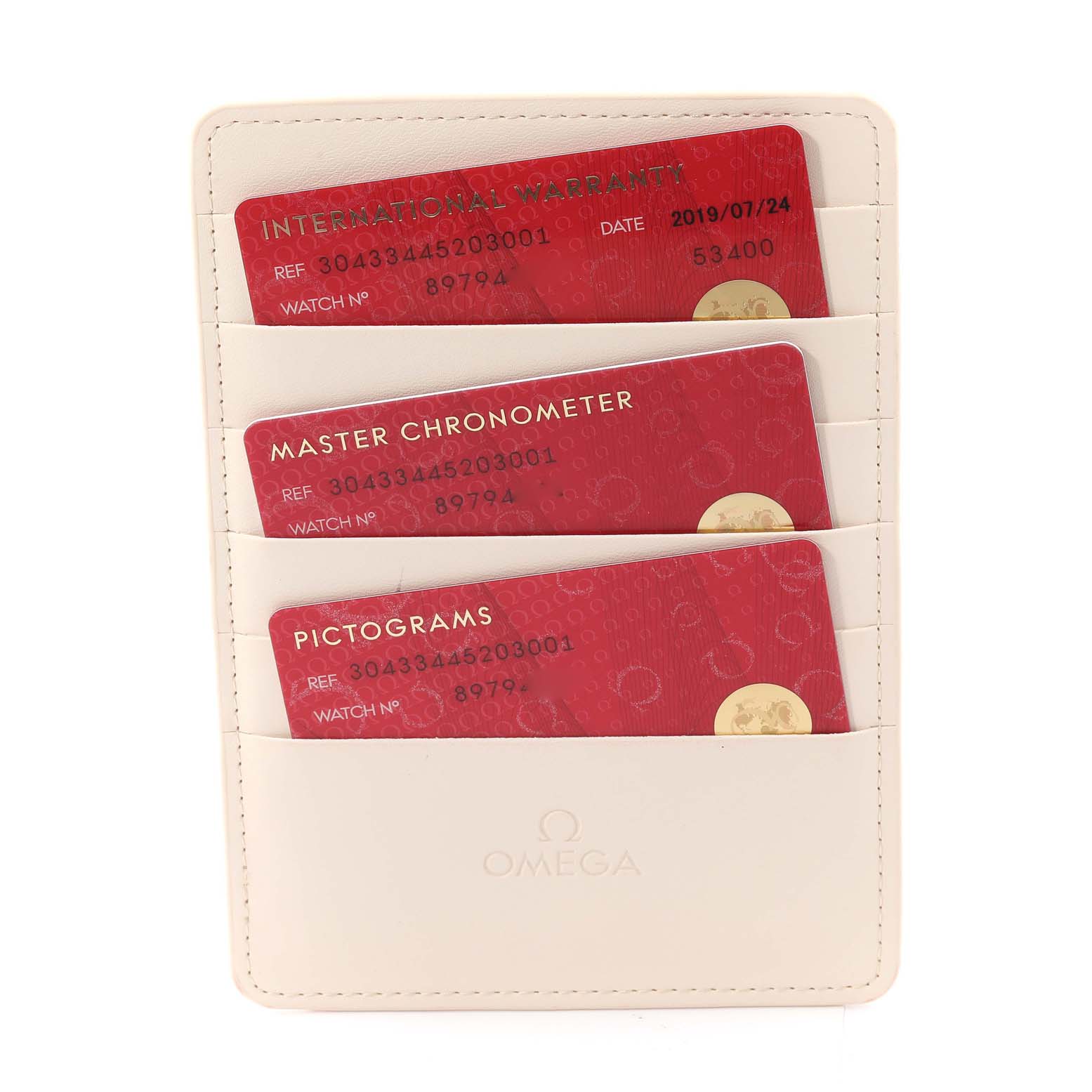 This image shows a set of Omega Speedmaster 304.33.44.52.03.001 Men's Stainless Steel Blue Dial 304.33.44.52.03.001 Men's Stainless Steel Blue Dial cards, including International Warranty, Master Chronometer, and Pictograms, held in a branded holder.