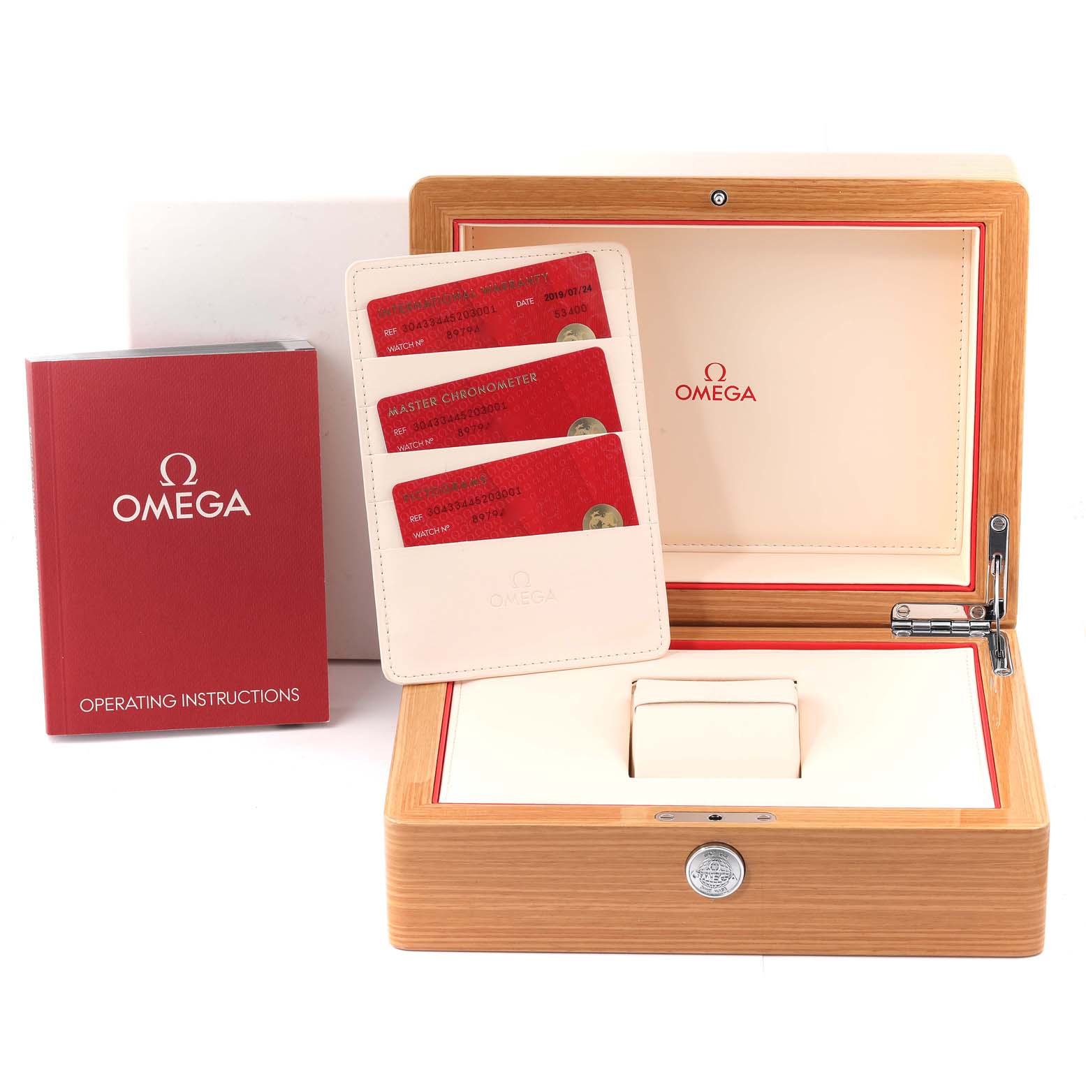 The image shows the Omega Speedmaster 304.33.44.52.03.001 Men's Stainless Steel Blue Dial 304.33.44.52.03.001 Men's Stainless Steel Blue Dial watch accessories, including the operating instructions, warranty cards, and storage box.