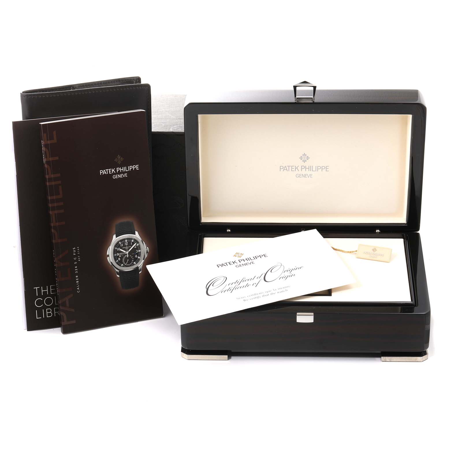 The image shows an open Patek Philippe Aquanaut 5164A Men's Stainless Steel Black Dial 5164A Men's Stainless Steel Black Dial watch box with certificates and manuals.