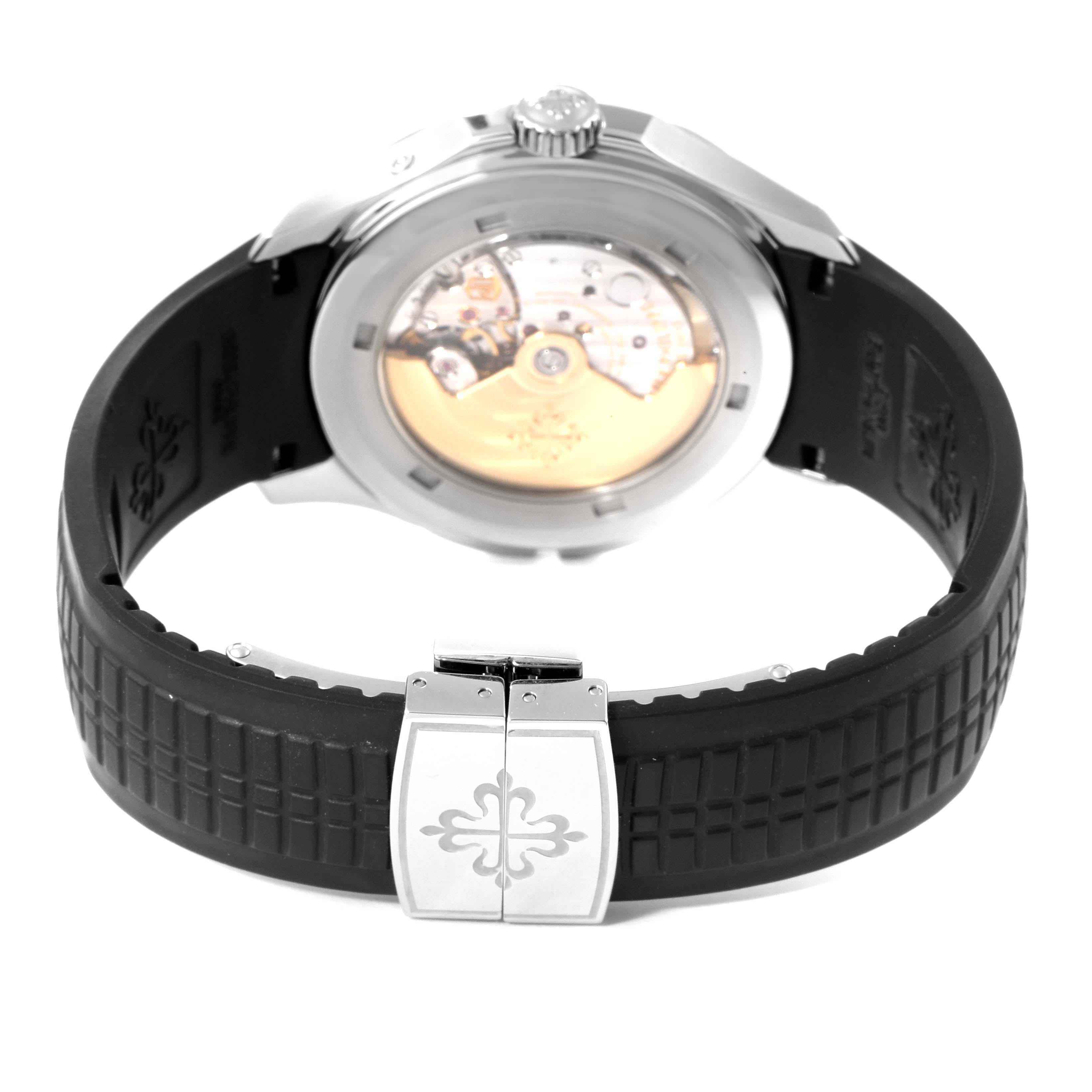 This image shows the back view of the Patek Philippe Aquanaut 5164A Men's Stainless Steel Black Dial 5164A Men's Stainless Steel Black Dial watch, highlighting its movement and rubber strap with a clasp.