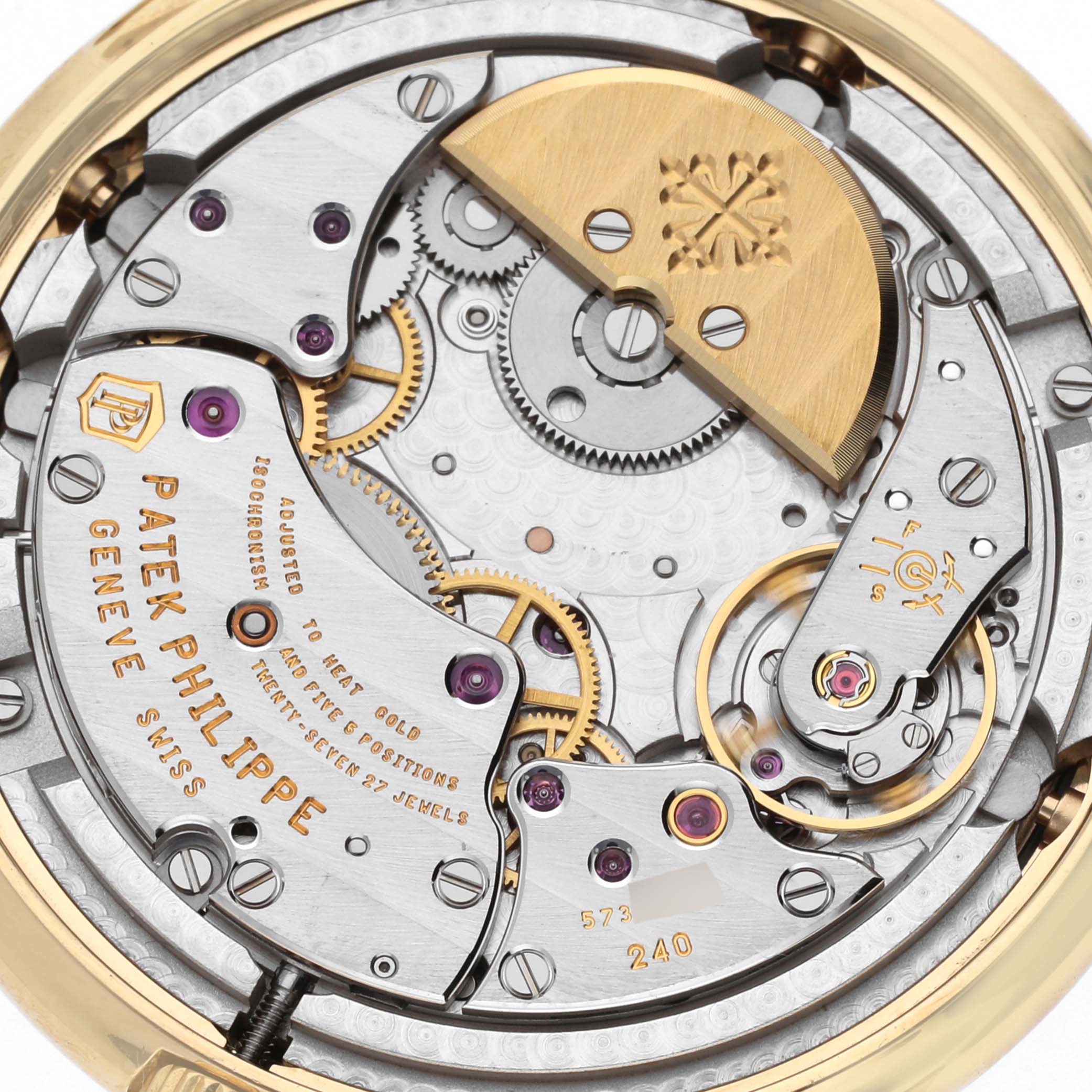 The image shows the intricate back view of the movement of a Patek Philippe Calatrava 5140J-001 Men
s Yellow Gold Silver Dial 5140J-001 Men
s Yellow Gold Silver Dial watch.