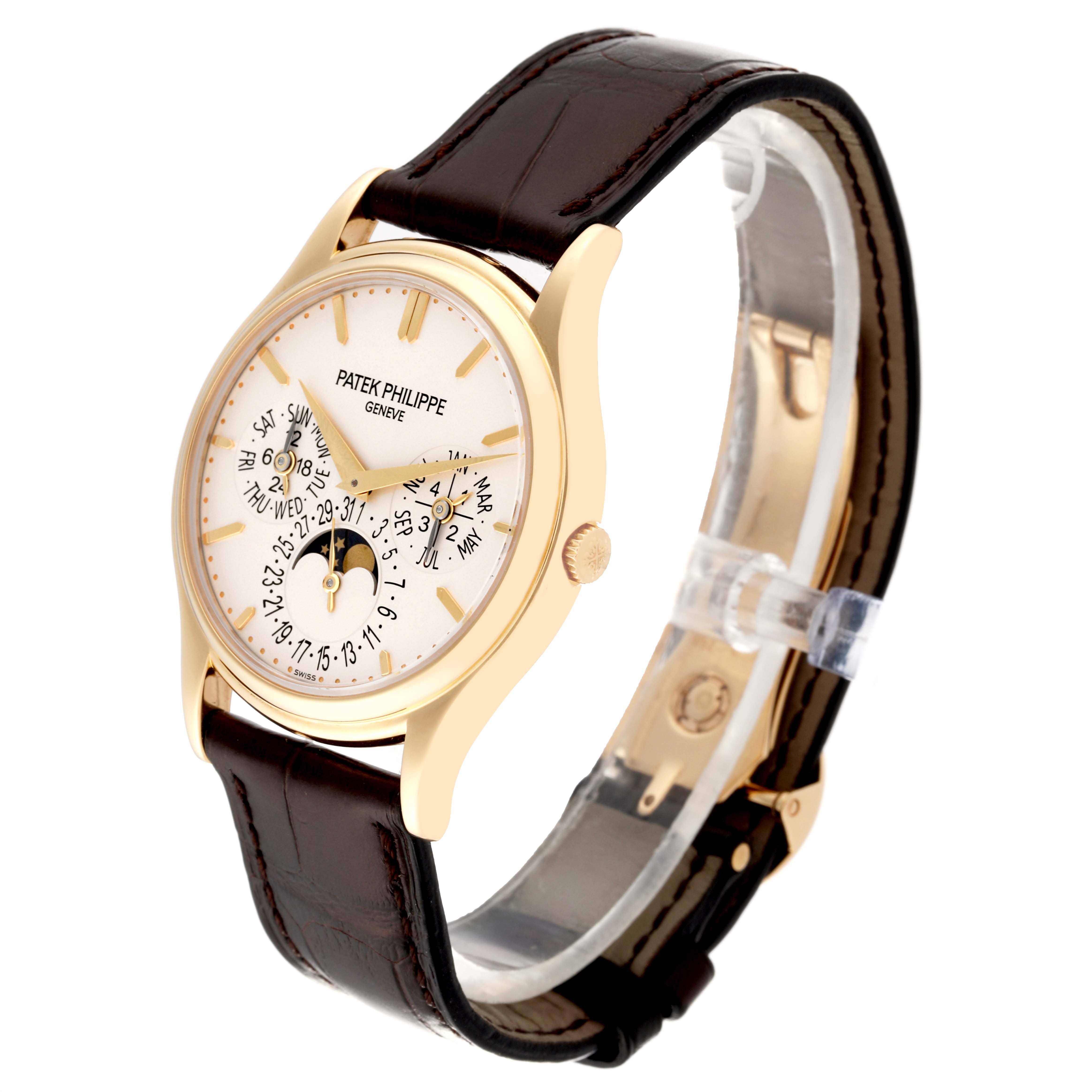 The Patek Philippe Calatrava 5140J-001 Men
s Yellow Gold Silver Dial 5140J-001 Men
s Yellow Gold Silver Dial watch is shown at a three-quarter angle, highlighting the dial, case, crown, and leather strap.