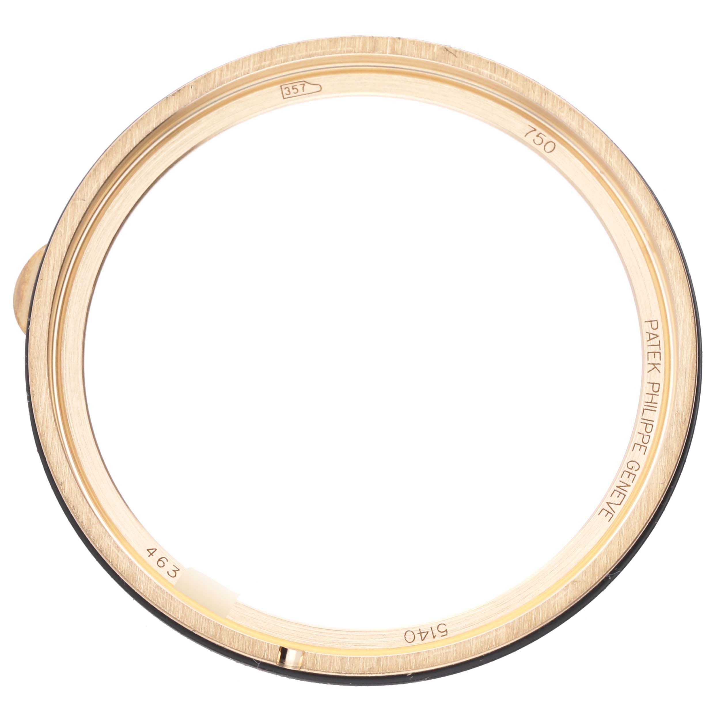 The image shows a gold bezel from a Patek Philippe Calatrava 5140J-001 Men
s Yellow Gold Silver Dial 5140J-001 Men
s Yellow Gold Silver Dial watch, viewed from the top.