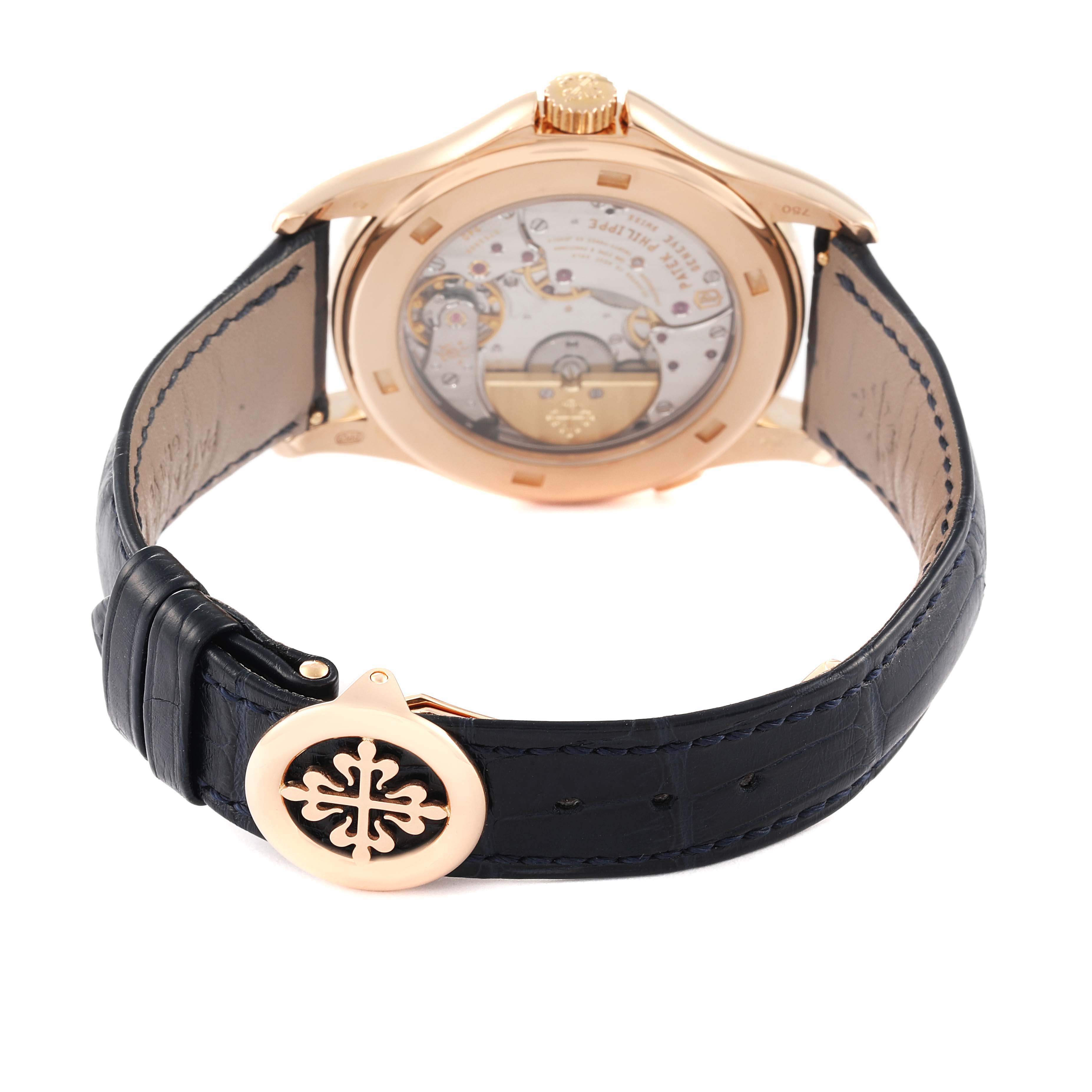 The image shows the back view of a Patek Philippe Complications 5130R Men's Rose Gold Silver Dial 5130R Men's Rose Gold Silver Dial watch, highlighting its transparent case back and leather strap.