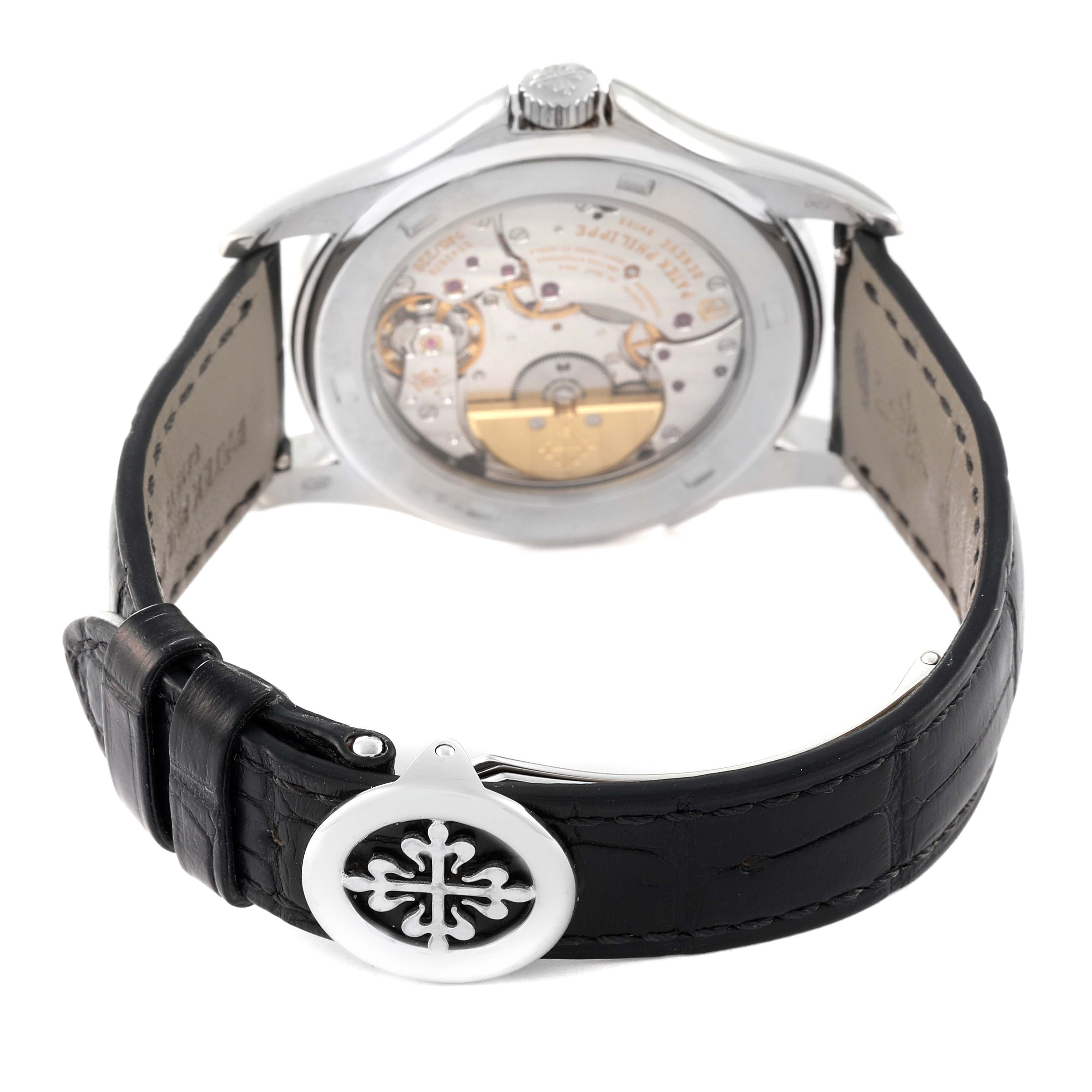 This image shows the back view of the Patek Philippe Complications 5130G-019 Men's White Gold Silver Dial 5130G-019 Men's White Gold Silver Dial watch, highlighting its movement and black leather strap.