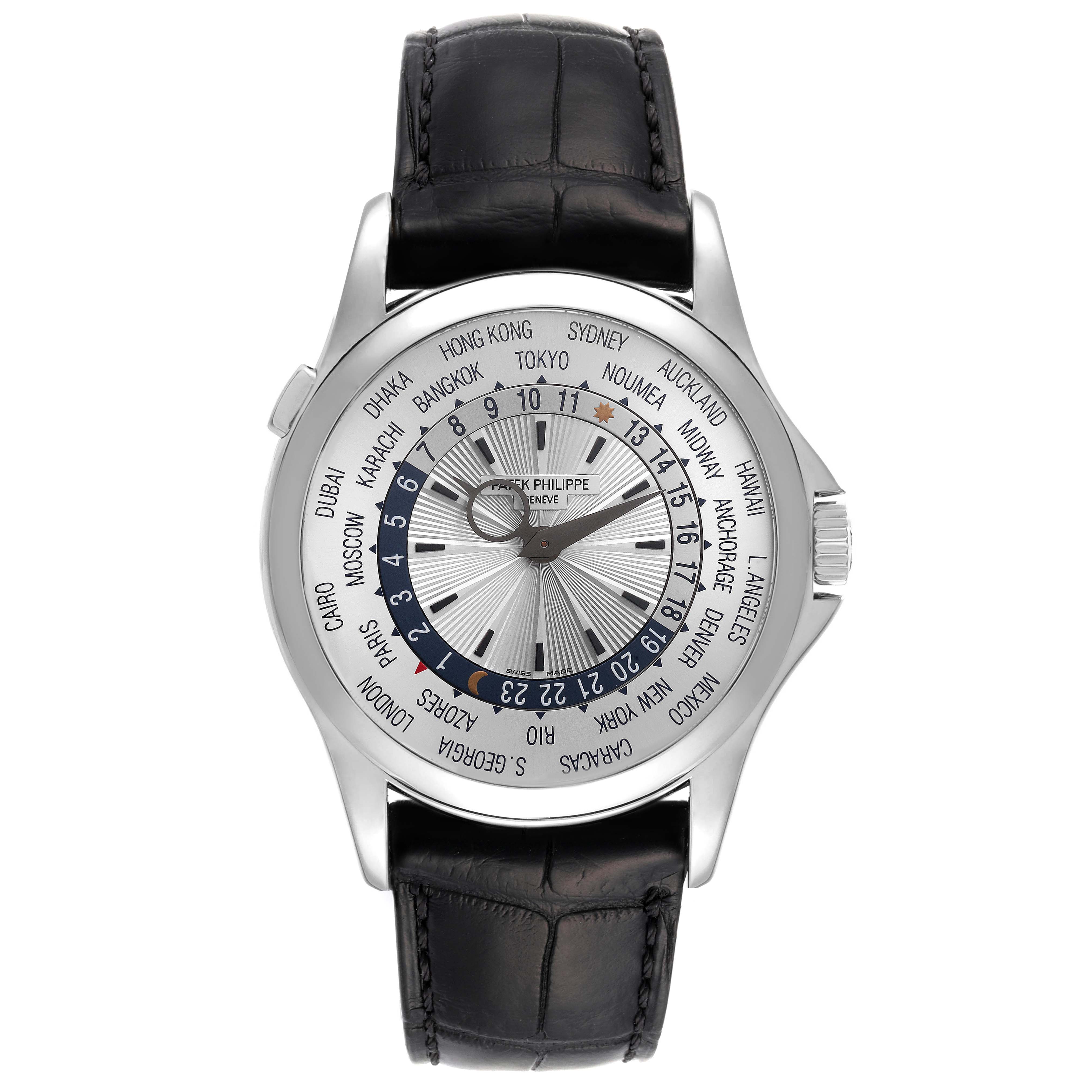 The image shows a front view of the Patek Philippe Complications 5130G-019 Men's White Gold Silver Dial 5130G-019 Men's White Gold Silver Dial watch, highlighting the dial and world time zones.