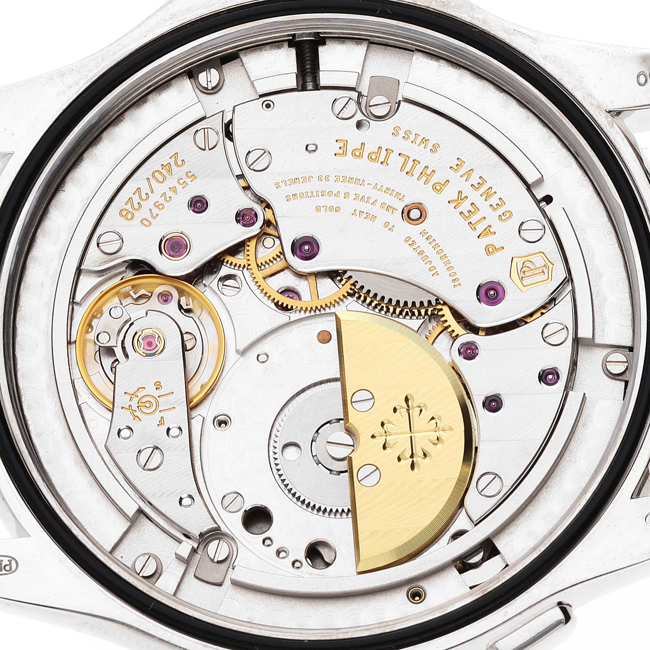 This image shows the intricate mechanism of a Patek Philippe Complications 5130G-019 Men's White Gold Silver Dial 5130G-019 Men's White Gold Silver Dial watch from a rear, close-up angle.