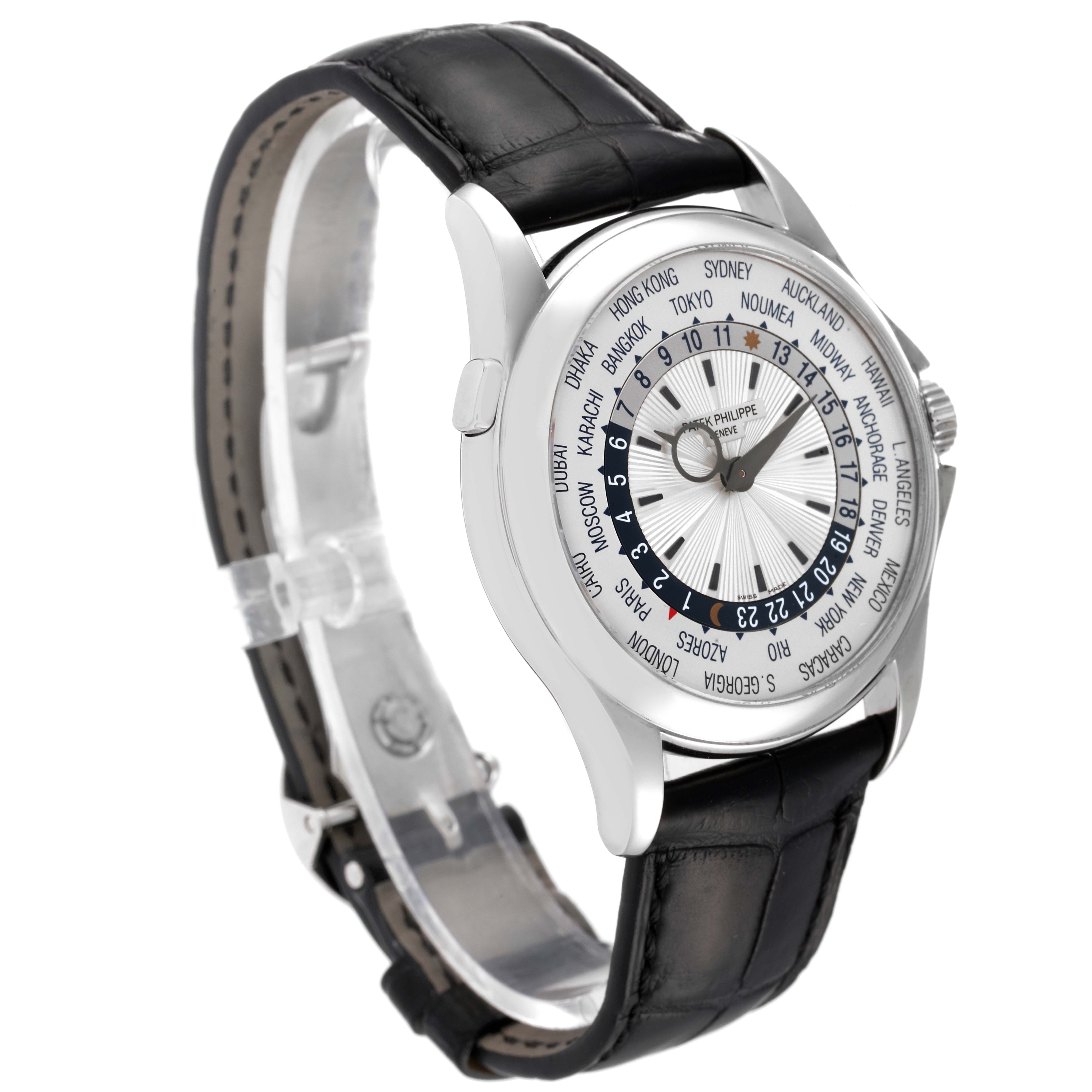 The image shows a Patek Philippe Complications 5130G-019 Men's White Gold Silver Dial 5130G-019 Men's White Gold Silver Dial model watch at a three-quarter angle, highlighting its face and black leather band.