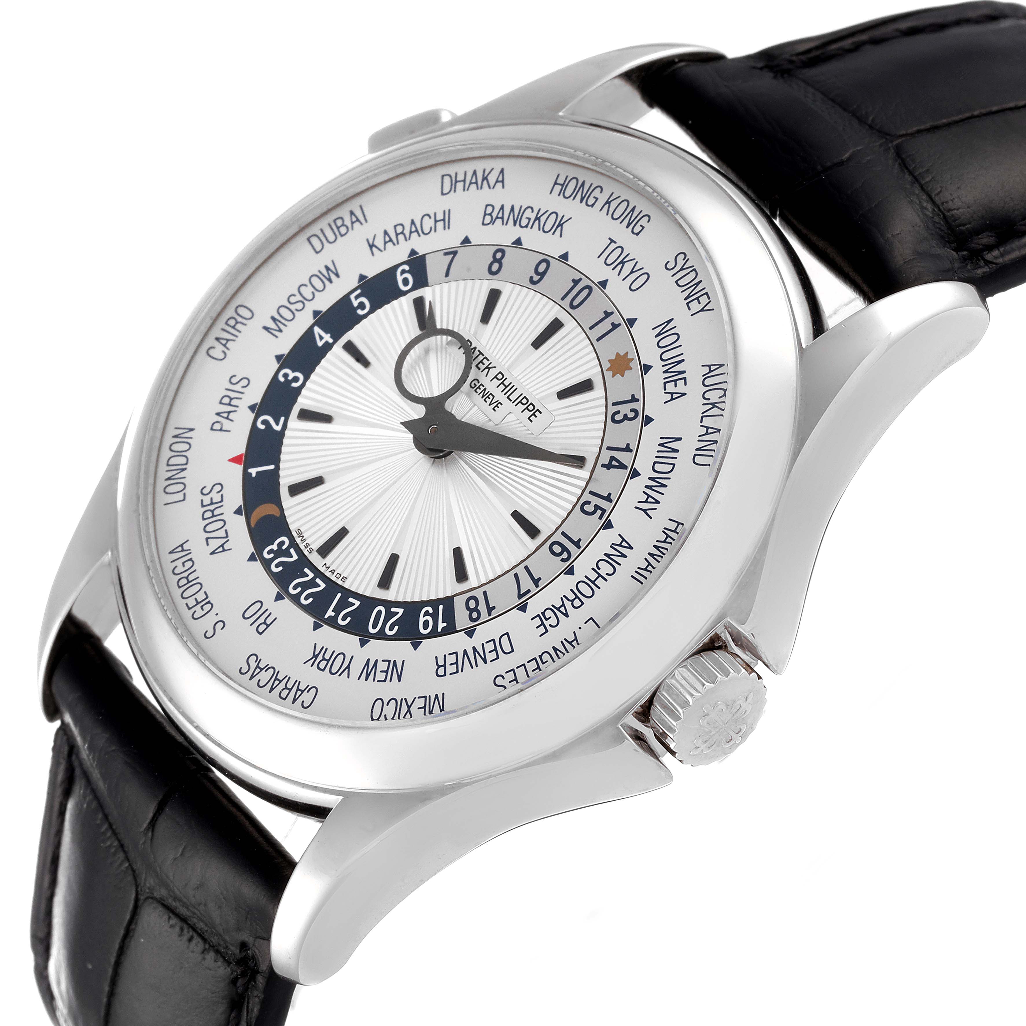 The image shows a side angle view of a Patek Philippe Complications 5130G-019 Men's White Gold Silver Dial 5130G-019 Men's White Gold Silver Dial watch, featuring its bezel, crown, and leather strap.