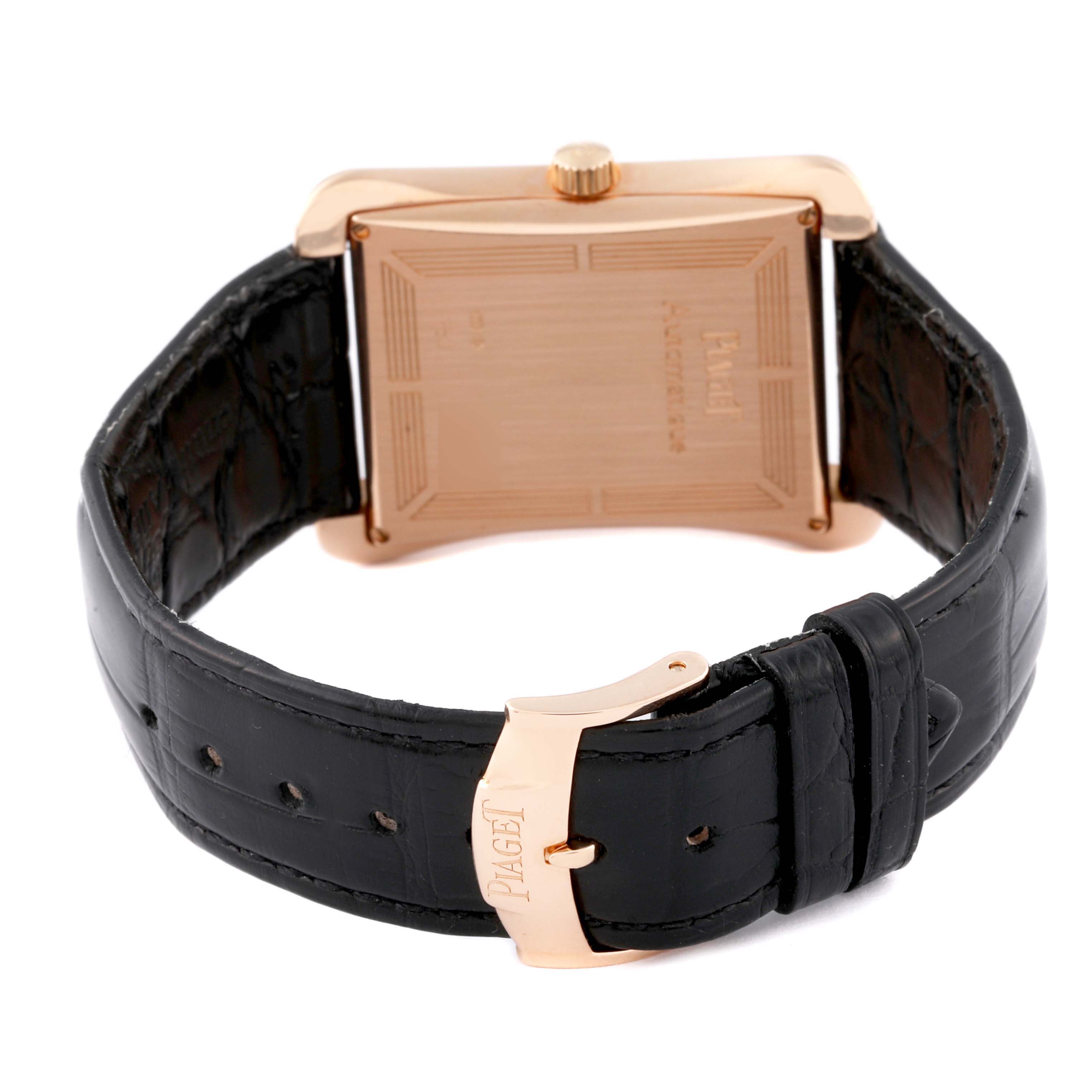 The Piaget G0A33070 Men's Rose Gold Silver Dial G0A33070 Men's Rose Gold Silver Dial Black Tie Emperador Coussin G0A33070 is shown from the rear, highlighting the rose gold case back and black leather strap.