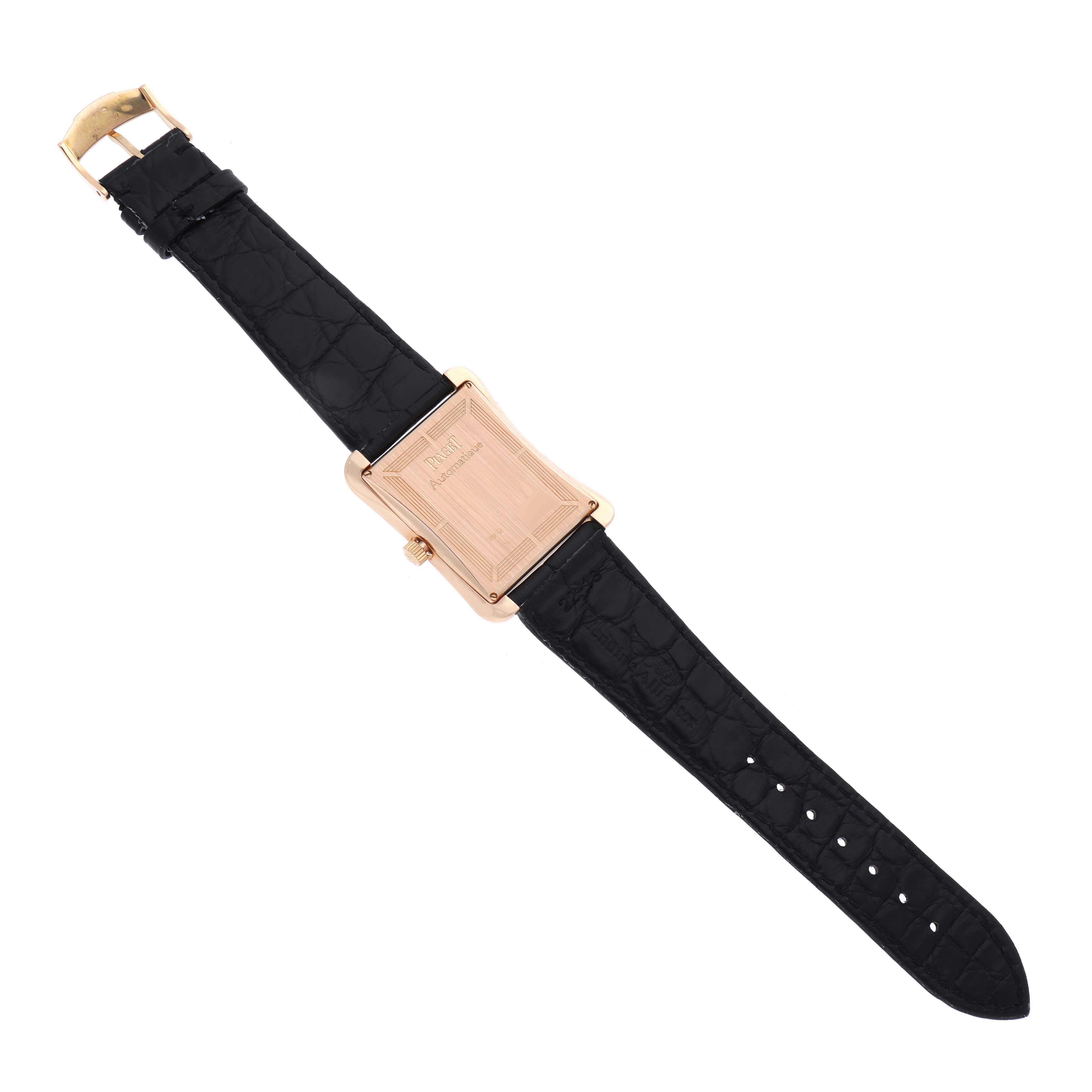 The Piaget G0A33070 Men's Rose Gold Silver Dial G0A33070 Men's Rose Gold Silver Dial Black Tie Emperador Coussin shows its back, rose gold case, and black strap in a top-down view.