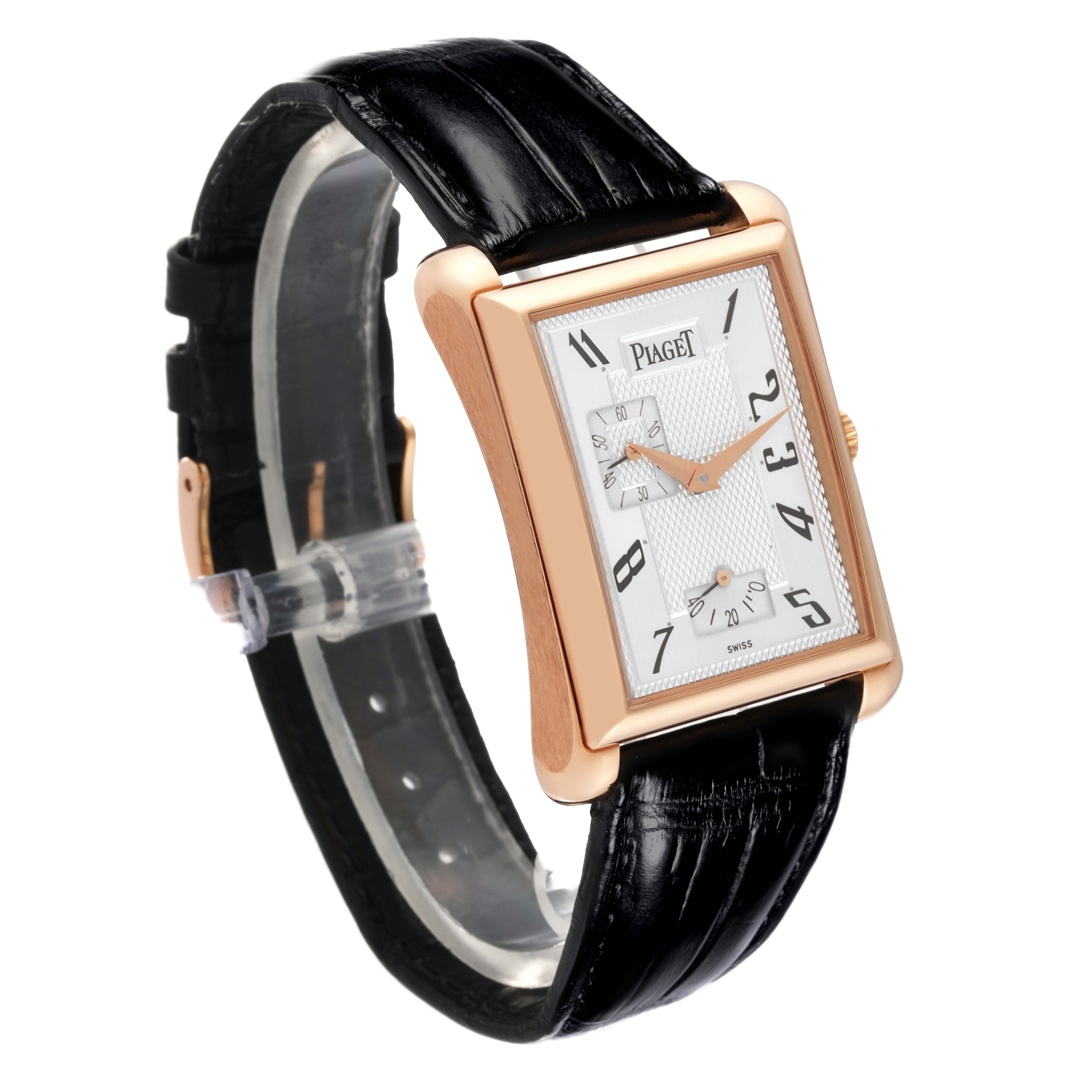 The Piaget G0A33070 Men's Rose Gold Silver Dial G0A33070 Men's Rose Gold Silver Dial Black Tie Emperador Coussin G0A33070 is shown at a three-quarter angle, highlighting its rose gold case and leather strap.