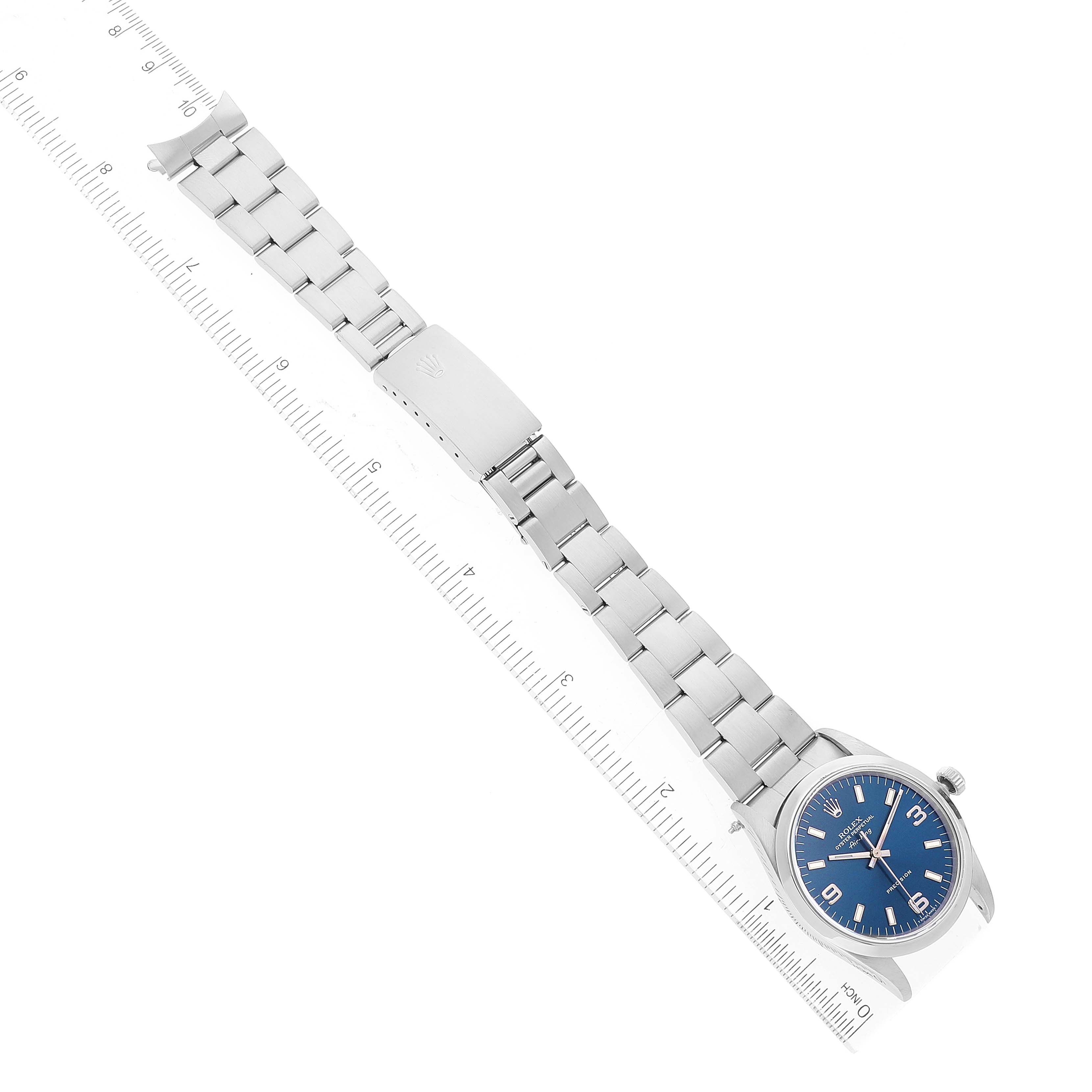 The image shows a Rolex Air-King 14000 Men's Stainless Steel Blue Dial 14000 Men's Stainless Steel Blue Dial watch laid flat, accompanied by a ruler to indicate its size.