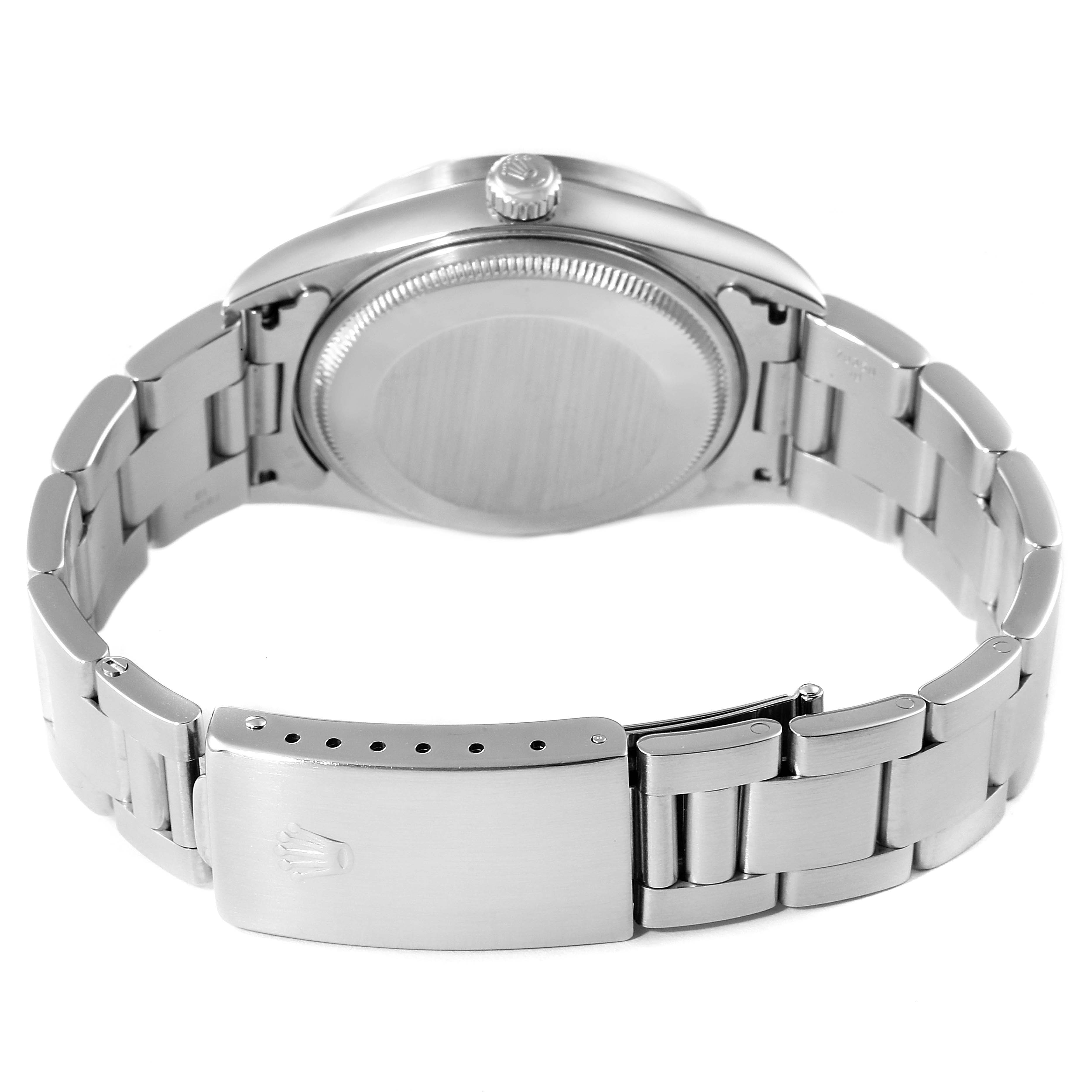 The image shows the back side and band of a Rolex Air-King 14010 Men's Stainless Steel White Dial 14010 Men's Stainless Steel White Dial watch at an angle that displays the clasp and screw-down caseback.