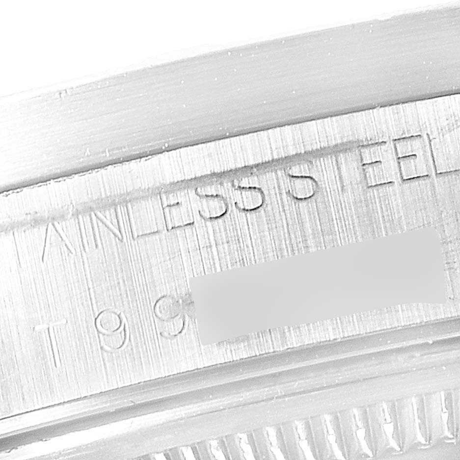 This image shows a close-up of the engraving on the case back of a Rolex Air-King 14010 Men's Stainless Steel White Dial 14010 Men's Stainless Steel White Dial watch.