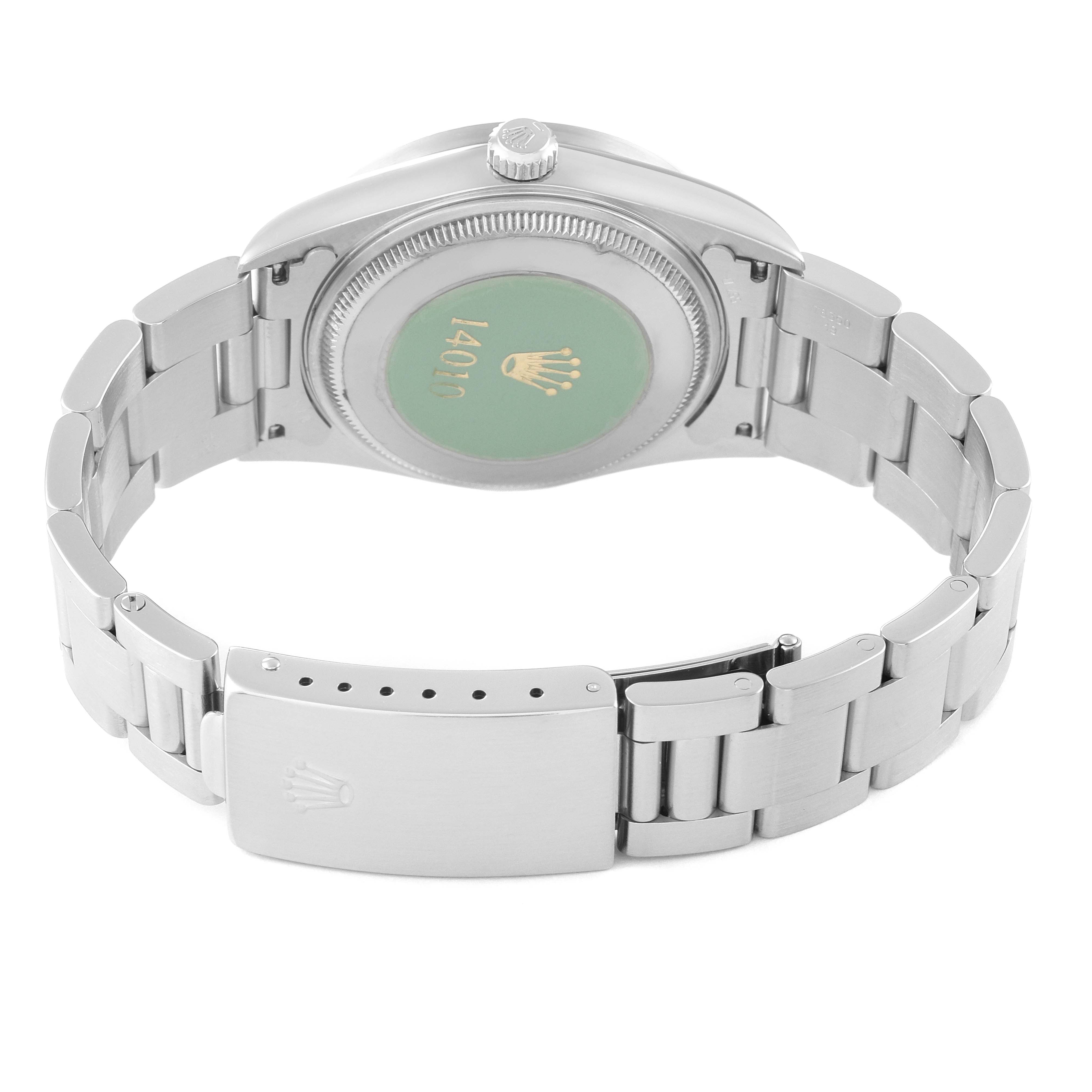 The image shows the back view of a Rolex Air-King 14010 Men's Stainless Steel Silver Dial 14010 Men's Stainless Steel Silver Dial watch, highlighting the case back, crown, and bracelet with clasp.