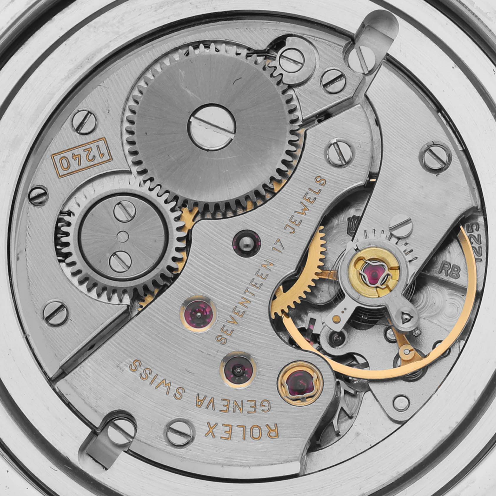 The image shows the movement mechanism of a Rolex Cellini 5241/6 Men
s Platinum Black Dial watch, highlighting gears and jewels in close-up detail.