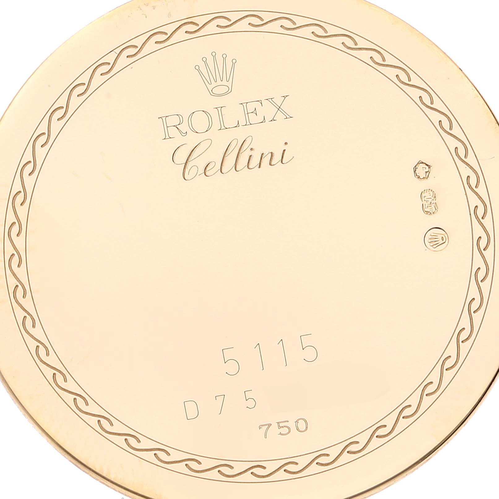 This close-up image shows the engraved back case of a Rolex Cellini 5115 Men's Yellow Gold Beige Dial 5115 Men's Yellow Gold Beige Dial model watch.