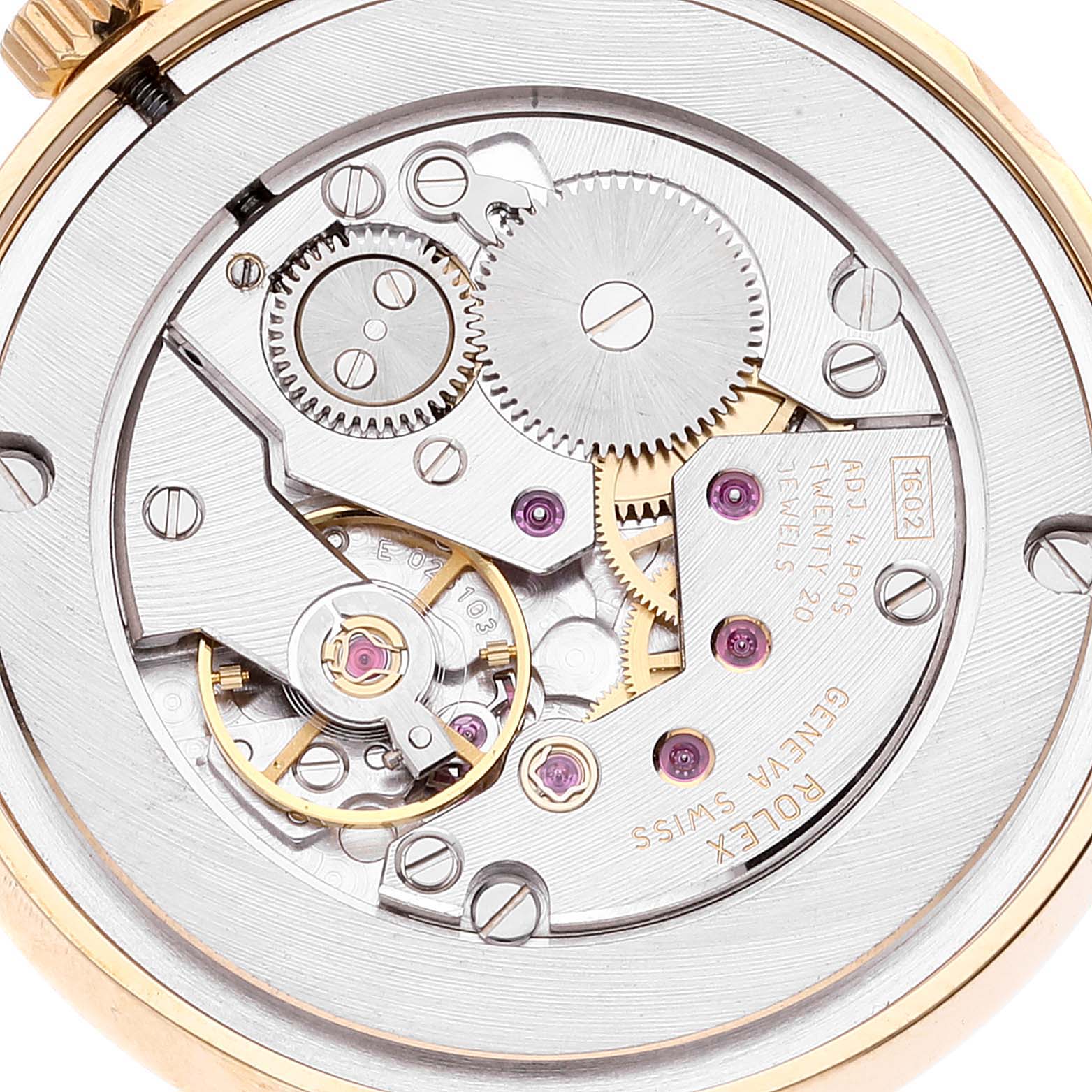 This image shows the back view of a Rolex Cellini 5115 Men's Yellow Gold Beige Dial 5115 Men's Yellow Gold Beige Dial, featuring its intricate mechanical movement and gears.