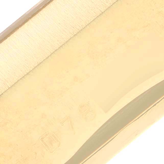 The image shows a close-up angle of the side of a Rolex Cellini 5440/8 Men
s Yellow Gold Champagne Dial 5440/8 Men
s Yellow Gold Champagne Dial watch, focusing on the edge and engravings.