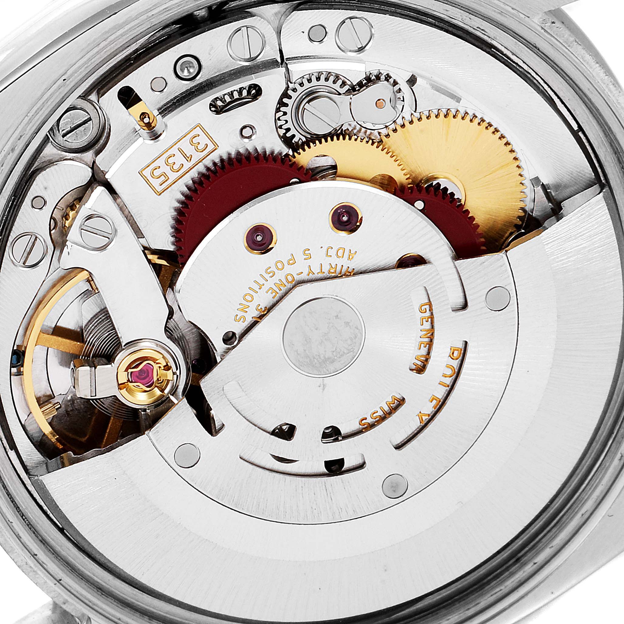 The image shows a close-up of the movement and internal mechanisms of a Rolex Date 115200 Men's Stainless Steel Black Dial 115200 Men's Stainless Steel Black Dial model watch.
