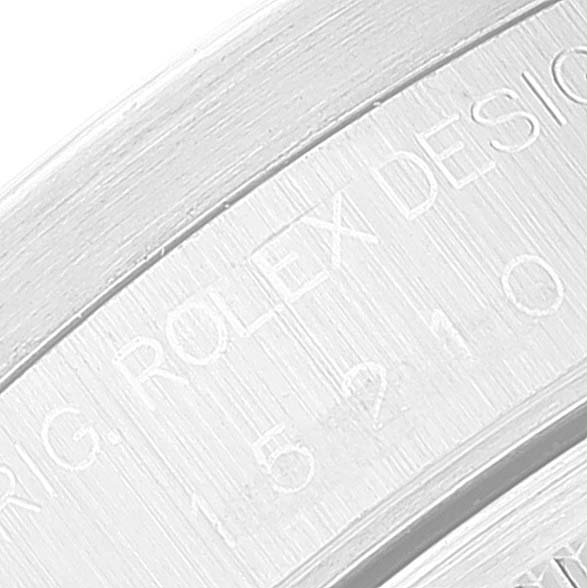 The image shows a close-up view of the engravings on the case side of a Rolex Date 15210 Men
s Stainless Steel Black Dial 15210 Men
s Stainless Steel Black Dial model.