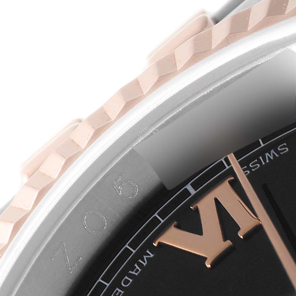 This close-up angle of the Rolex Datejust 116231 Men's Steel and Gold (two tone) Black Dial 116231 Men's Steel and Gold (two tone) Black Dial shows part of the bezel, the dial edge, and a "VI" numeral.