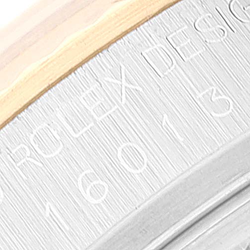 This close-up image shows the serial number engraving on the case side of a Vintage Collection Rolex watch, model 16013.