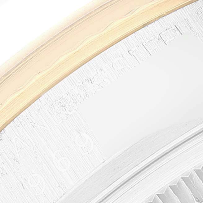 This image shows a close-up of the bezel and part of the case of a Rolex Vintage Collection 16013 Men's Steel and Gold (two tone) Champagne Dial 16013 Men's Steel and Gold (two tone) Champagne Dial watch.