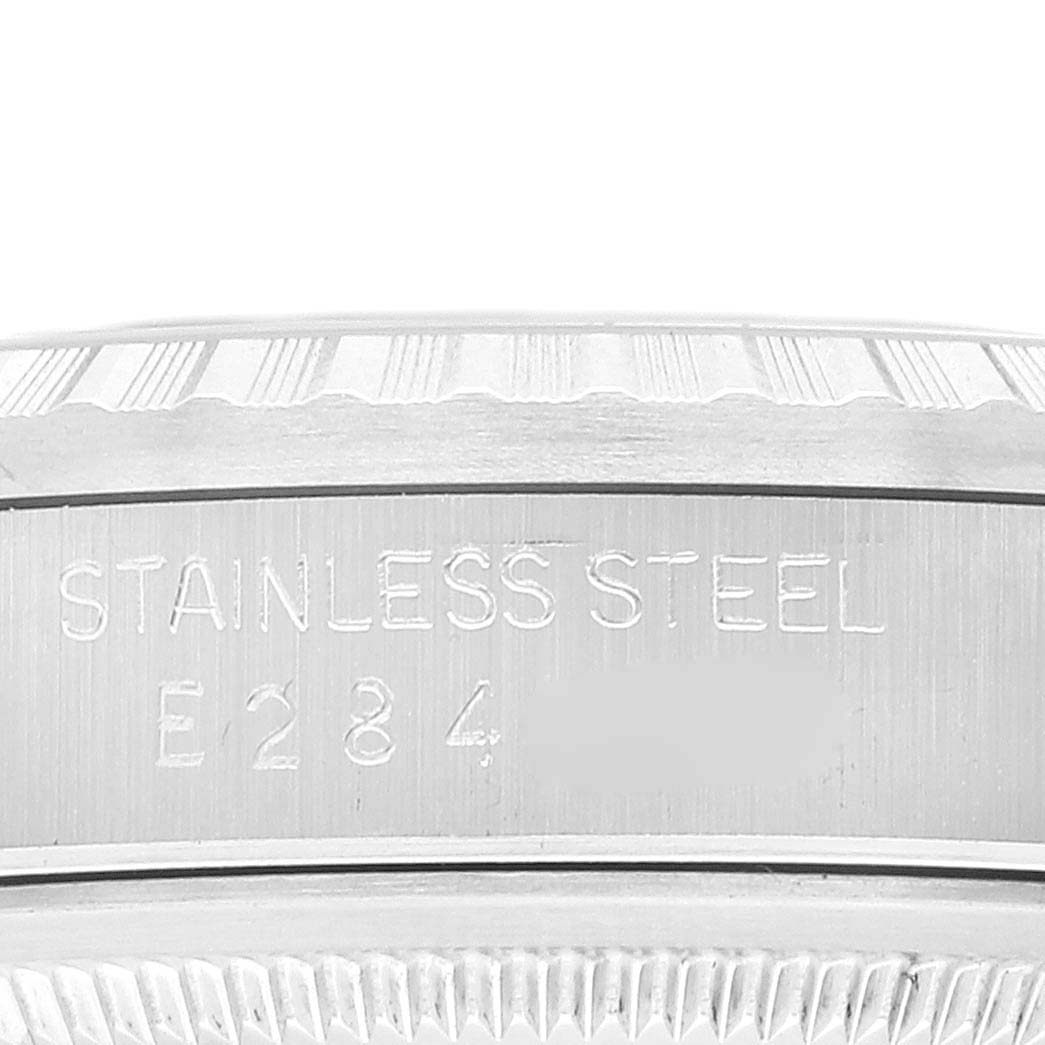The image shows a close-up view of the case side and bezel of a Rolex Datejust 16220 Men's Stainless Steel White Dial 16220 Men's Stainless Steel White Dial, highlighting the "Stainless Steel" engraving.