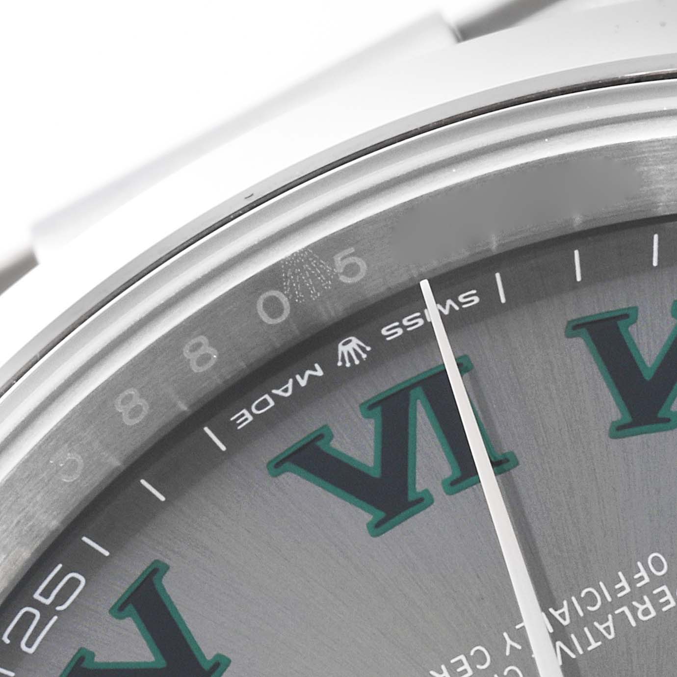This close-up of the Rolex Datejust 41 126300 Men
s Stainless Steel Grey Dial 126300 Men
s Stainless Steel Grey Dial watch shows part of the dial, featuring the "Swiss Made" label and Roman numeral markings.