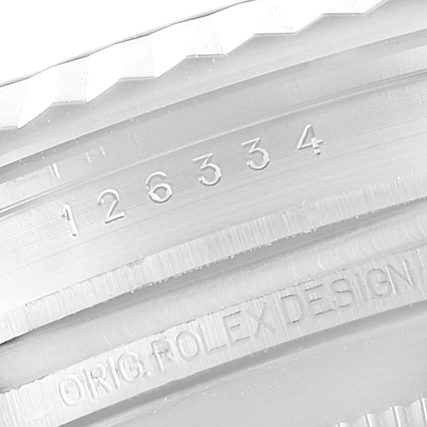 This image shows a close-up view of the fluted bezel and engraving on a Rolex Datejust 41 126334 Men's Stainless Steel Silver Dial 126334 Men's Stainless Steel Silver Dial model.