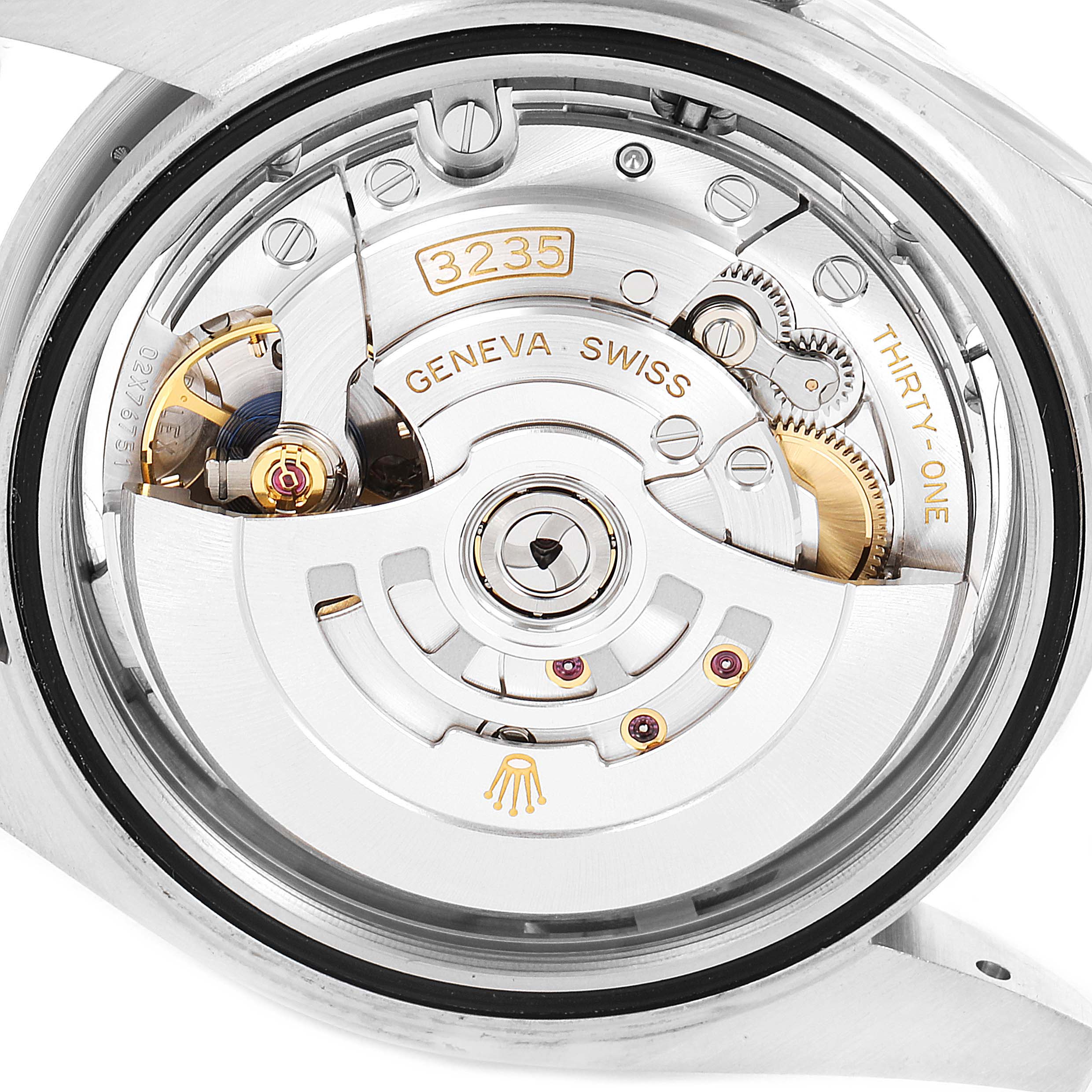 This image shows the movement of a Rolex Datejust 41 126334 Men's Stainless Steel Silver Dial 126334 Men's Stainless Steel Silver Dial from the back, highlighting the intricate mechanism and parts labeled "3235" and "GENEVA SWISS."