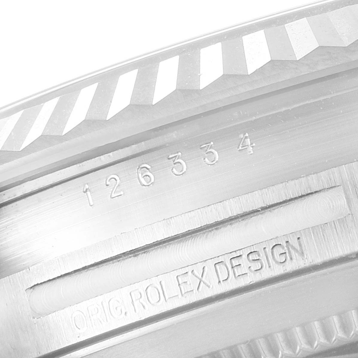 The image shows a close-up of the bezel and case edge of a Rolex Datejust 41 126334 Men
s Stainless Steel White Dial 126334 Men
s Stainless Steel White Dial, displaying the model number and "ORIG. ROLEX DESIGN" engraving.