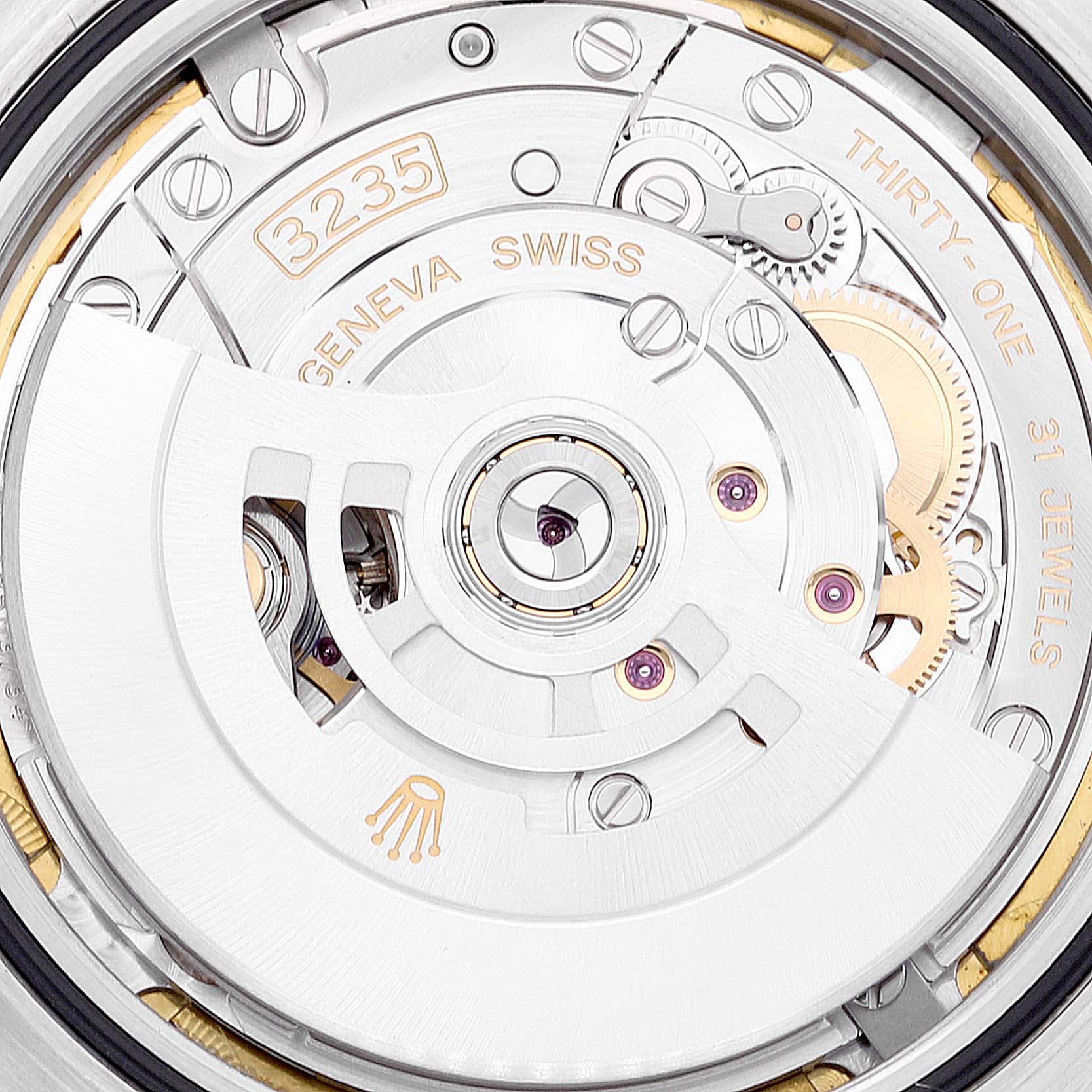 This close-up image shows the intricate movement mechanism of the Rolex Datejust 41 126333 Men's Steel and Gold (two tone) White Dial 126333 Men's Steel and Gold (two tone) White Dial watch, including gears and the oscillating weight.