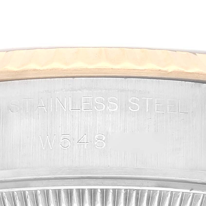 The image shows a close-up of the stainless steel case side and fluted bezel of a Rolex Datejust 69173 Women's Stainless Steel Blue Dial 69173 Women's Stainless Steel Blue Dial watch.