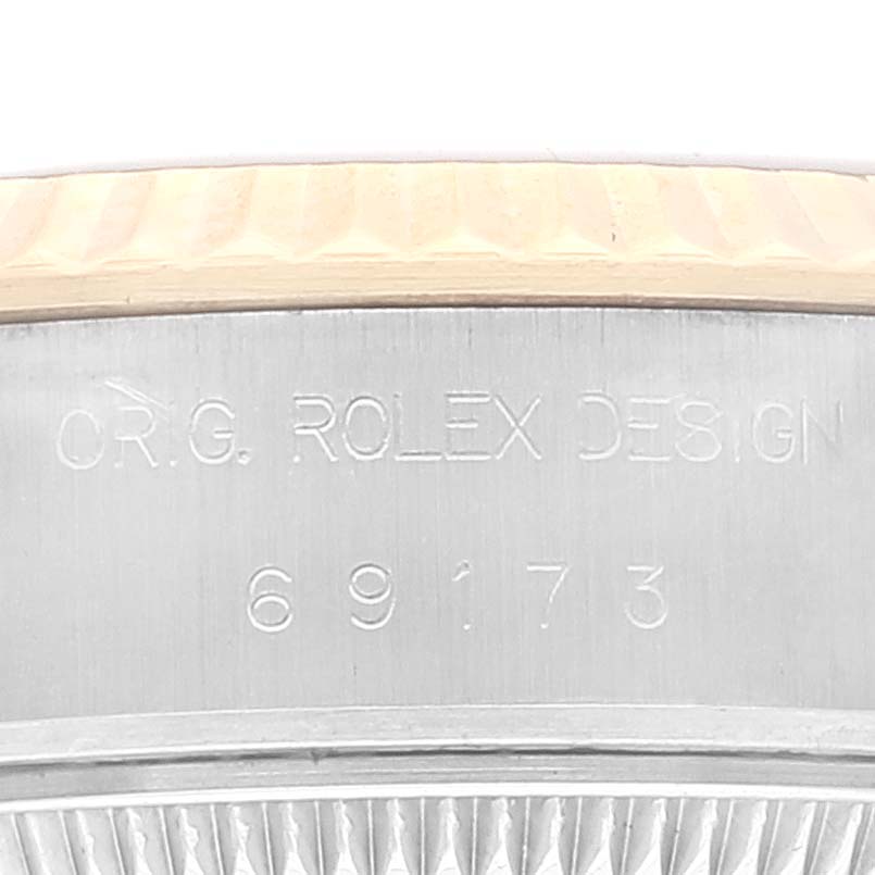 This image shows a close-up of the case back engraving of a Rolex Datejust 69173 Women's Stainless Steel Blue Dial 69173 Women's Stainless Steel Blue Dial watch, displaying the model number 69173.