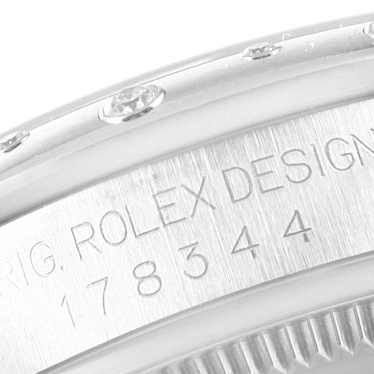 Close-up of a Rolex Mid-Size 178344 Women
s Stainless Steel Mother of Pearl Dial 178344 Women
s Stainless Steel Mother of Pearl Dial model showing the engraved design number and part of the diamond-studded bezel.