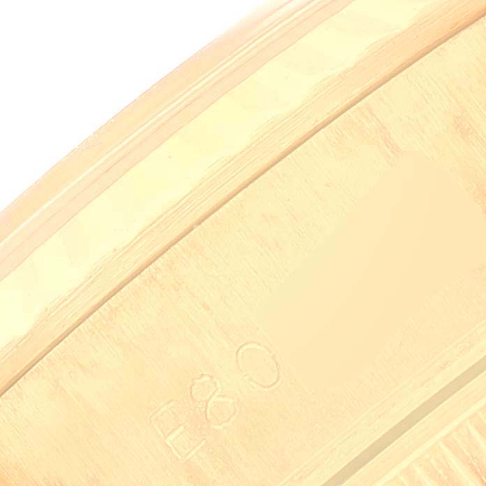 The image shows a close-up view of the caseback edge of a Rolex President 69178 Women's Yellow Gold Champagne Dial 69178 Women's Yellow Gold Champagne Dial model watch, highlighting hallmark engravings.