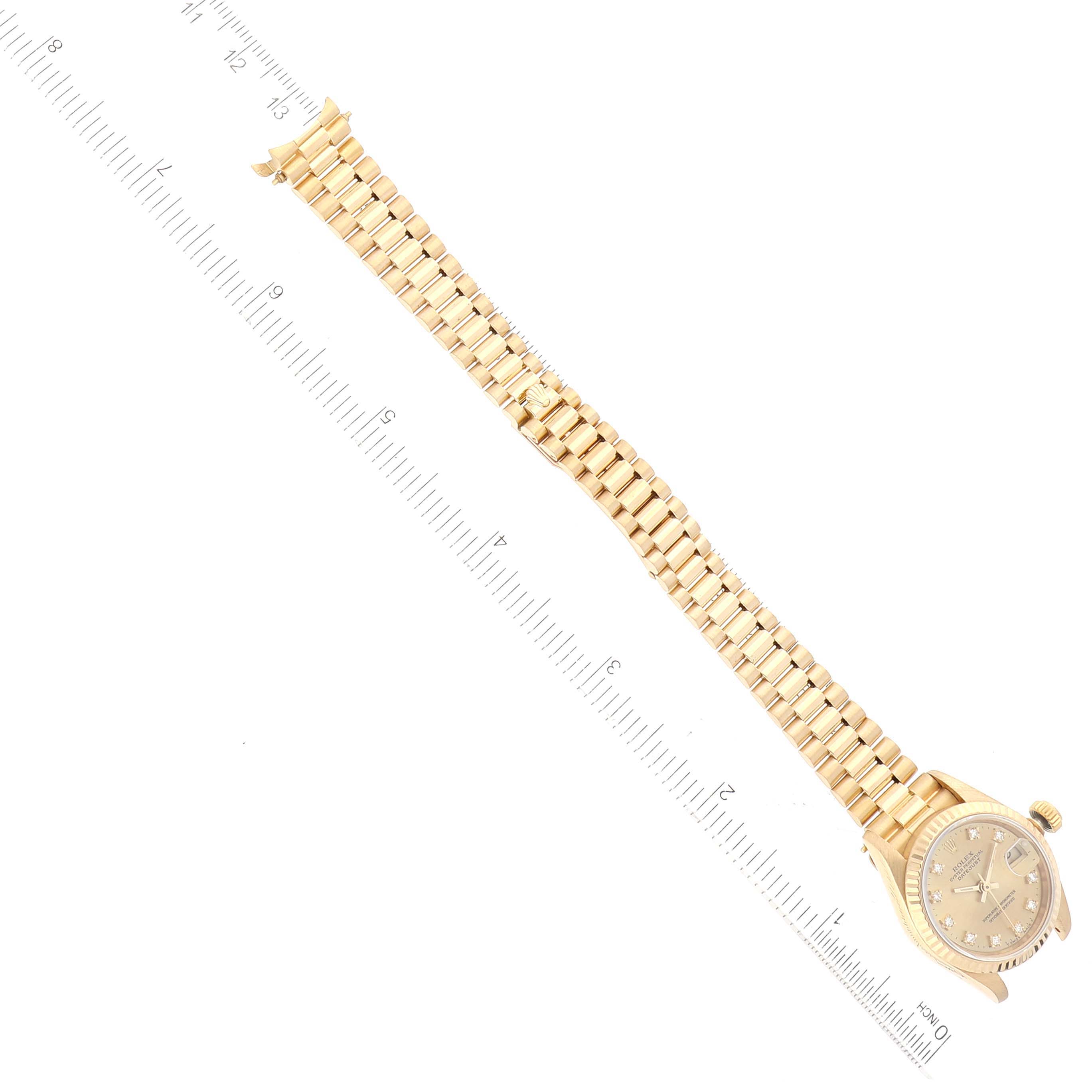 The image shows a Rolex President 69178 Women's Yellow Gold Champagne Dial 69178 Women's Yellow Gold Champagne Dial watch, including its face, crown, and full gold bracelet, taken from a top-down angle.