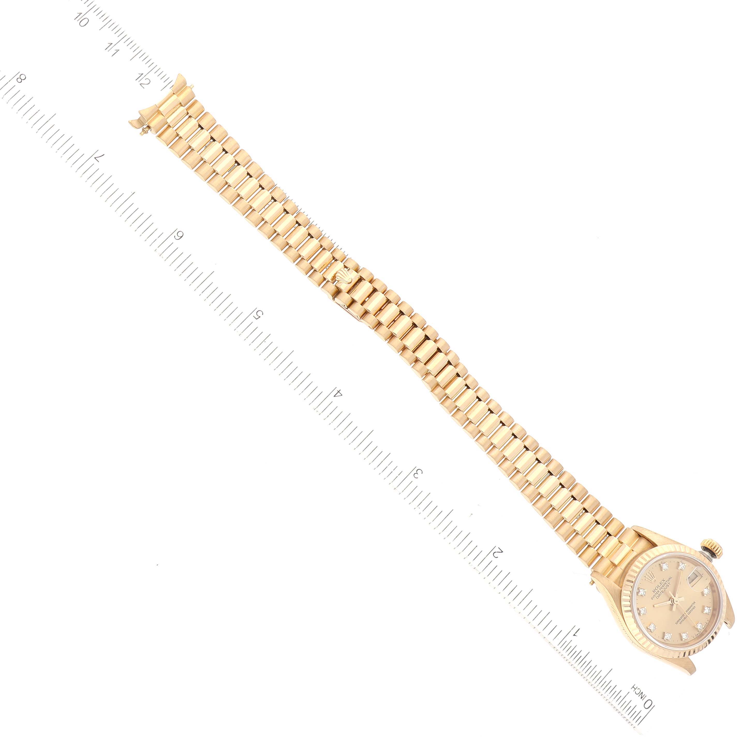 This image shows a Rolex President 69178 Women
s Yellow Gold Champagne Dial 69178 Women
s Yellow Gold Champagne Dial model watch positioned flat with the dial and full length of the band visible.