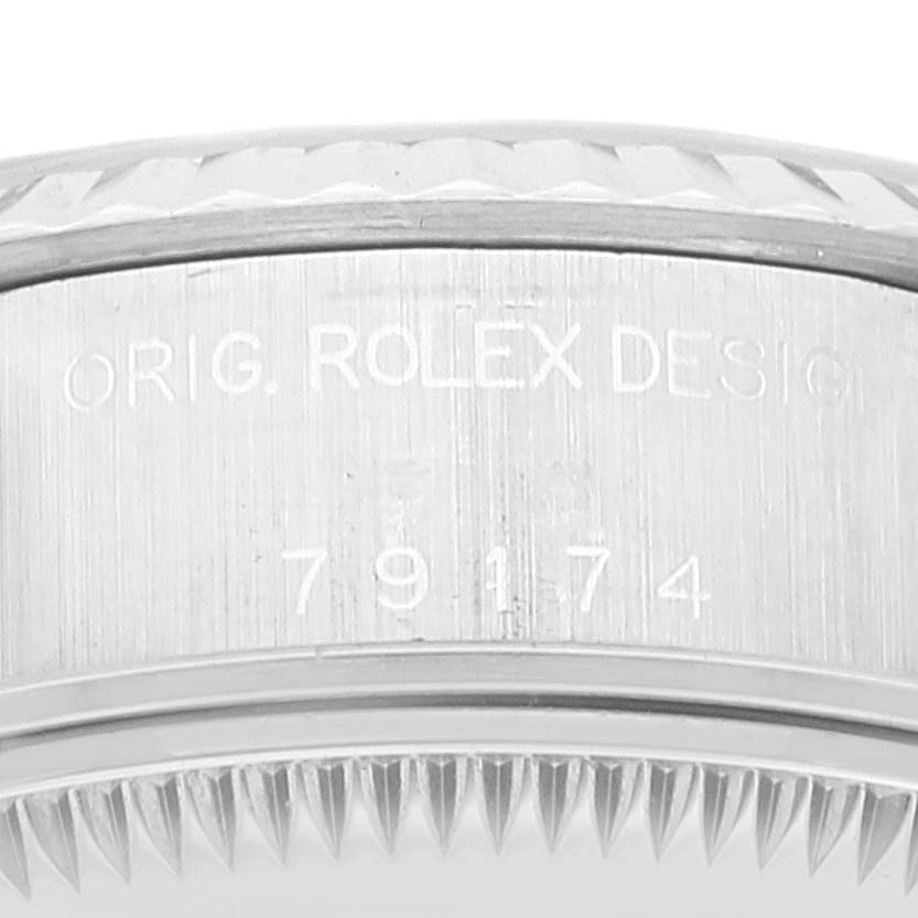 This image shows a close-up of the side case, including the case back edge, with model number engraving from a Rolex Datejust 79174 Women's Stainless Steel Silver Dial 79174 Women's Stainless Steel Silver Dial watch.