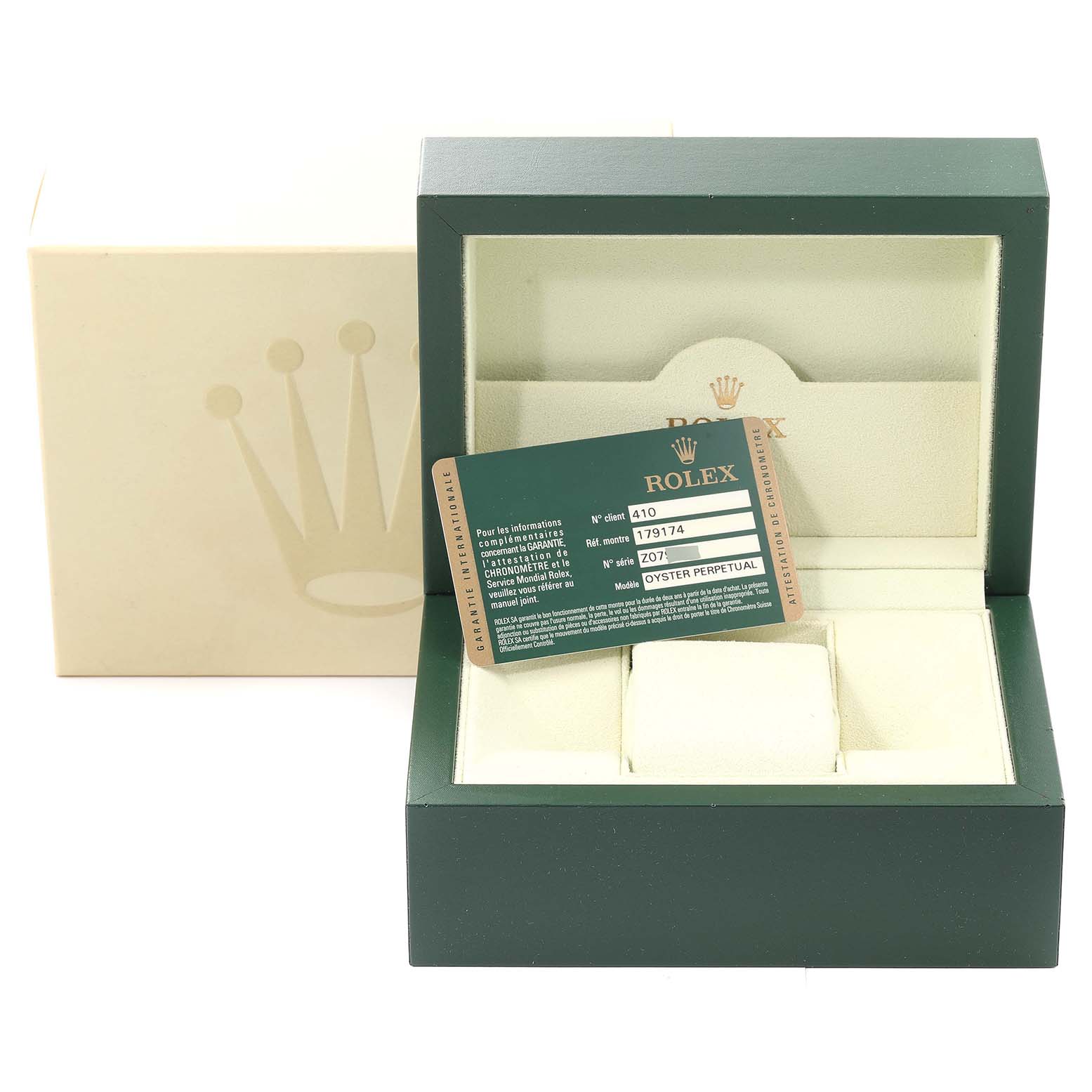 This image shows a Rolex Datejust 179174 Women's Stainless Steel Pink Dial 179174 Women's Stainless Steel Pink Dial watch box and warranty card, with the box open at a slight angle displaying its interior.