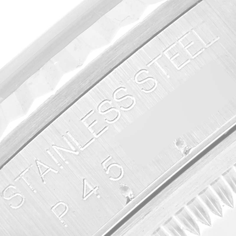 This close-up image shows the edge of the stainless steel casing and part of the bezel of a Rolex Datejust 16234 Men's Stainless Steel White Dial 16234 Men's Stainless Steel White Dial model watch.
