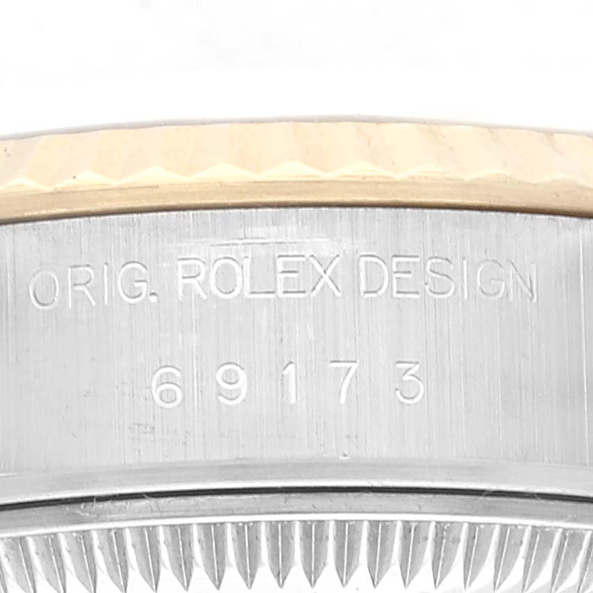 The image shows a close-up of the case part of a Rolex Datejust 69173 Women's Steel and Gold (two tone) Champagne Dial 69173 Women's Steel and Gold (two tone) Champagne Dial watch, displaying the model number and "Orig. Rolex Design" engraving.