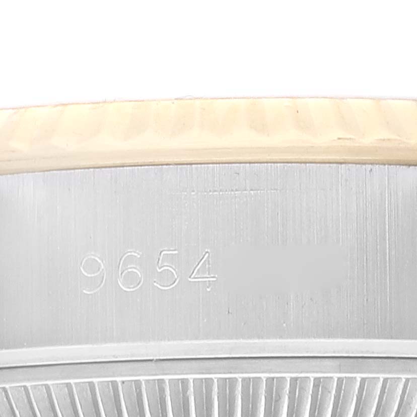 Close-up of the caseback of a Rolex Datejust 69173 Women's Steel and Gold (two tone) Champagne Dial 69173 Women's Steel and Gold (two tone) Champagne Dial, showing the serial number engraving.