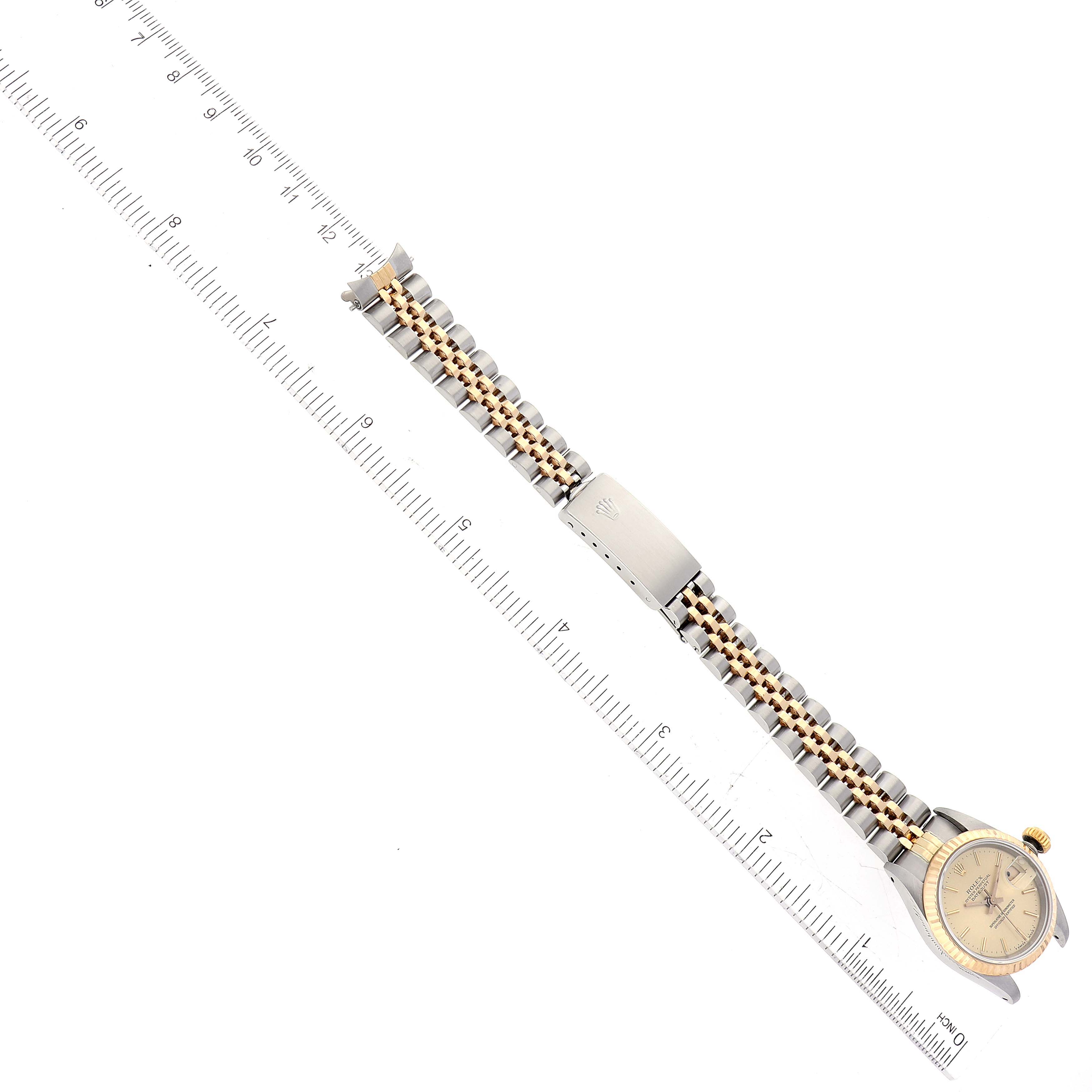 This image shows the Rolex Datejust 69173 Women's Steel and Gold (two tone) Champagne Dial 69173 Women's Steel and Gold (two tone) Champagne Dial watch from a top-down angle, featuring the face, bracelet, and clasp.