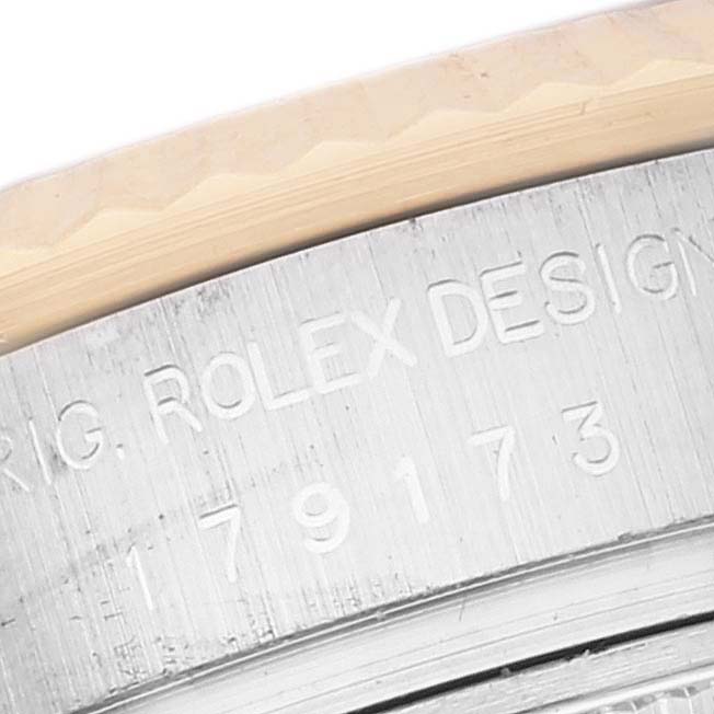 This image shows a close-up of the engraved case back of a Rolex Datejust 179173 Women's Steel and Gold (two tone) Pink Dial 179173 Women's Steel and Gold (two tone) Pink Dial watch, featuring the model number.