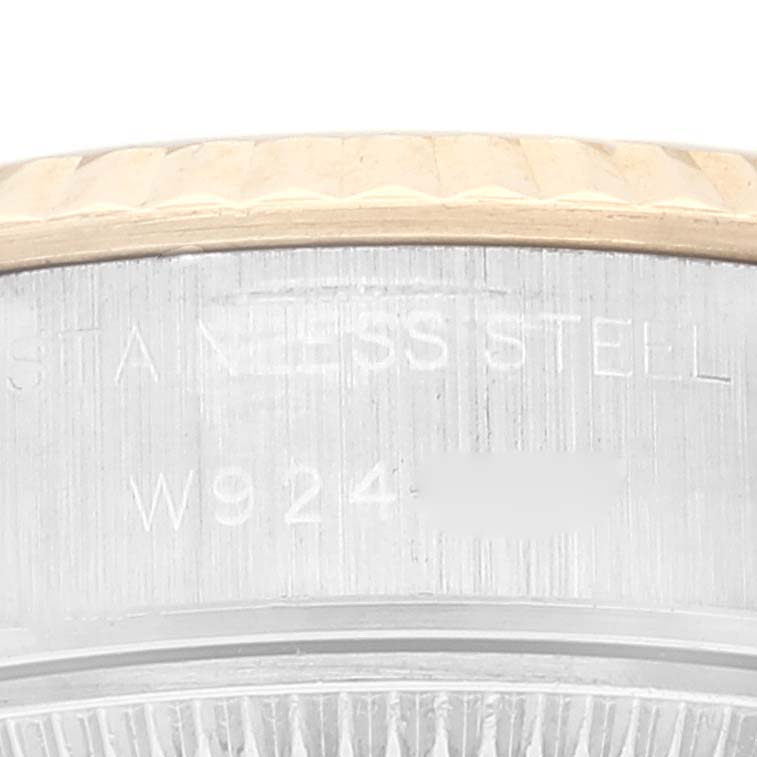 This image shows a close-up of the side of a Rolex Datejust 69173 Women's Steel and Gold (two tone) Champagne Dial 69173 Women's Steel and Gold (two tone) Champagne Dial watch, featuring the bezel and engraved model number.