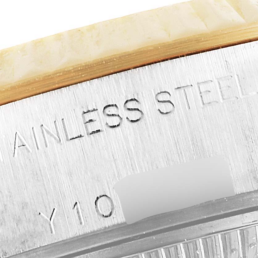 This close-up angle shows the stainless steel part of the Rolex Datejust 79173 Women's Steel and Gold (two tone) Champagne Dial 79173 Women's Steel and Gold (two tone) Champagne Dial's case, highlighting the model's engraved text.